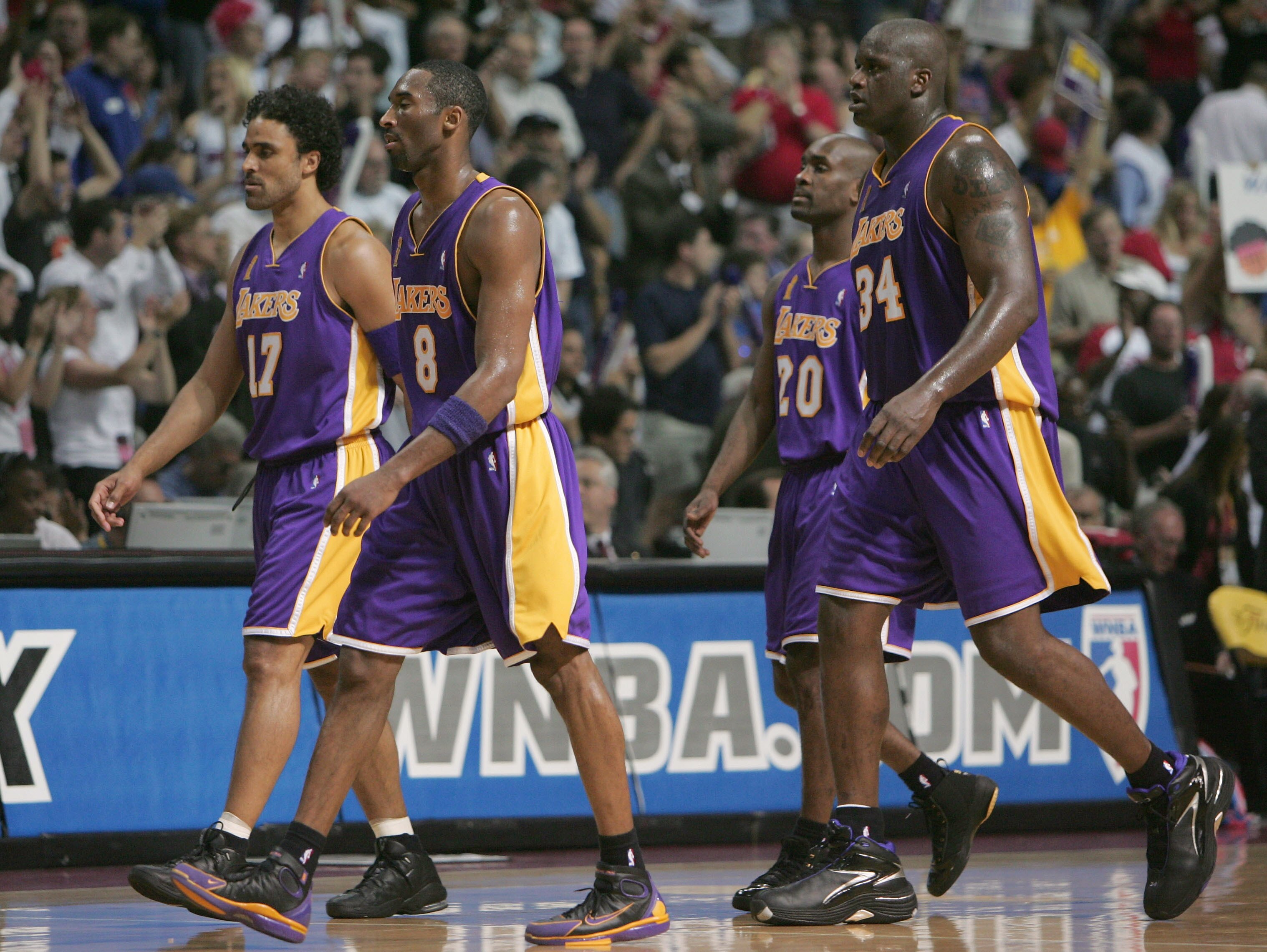 AUBURN HILLS, MI - JUNE 15: (L-R)  Rick Fox #17, Kobe Bryant #8, Gary Payton #20 and Shaquille O'Neal #34 of he Los Angeles Lakers walk towards the bench in the second quarter of game five of the 2004 NBA Finals against the Detroit Pistons on June 15, 200