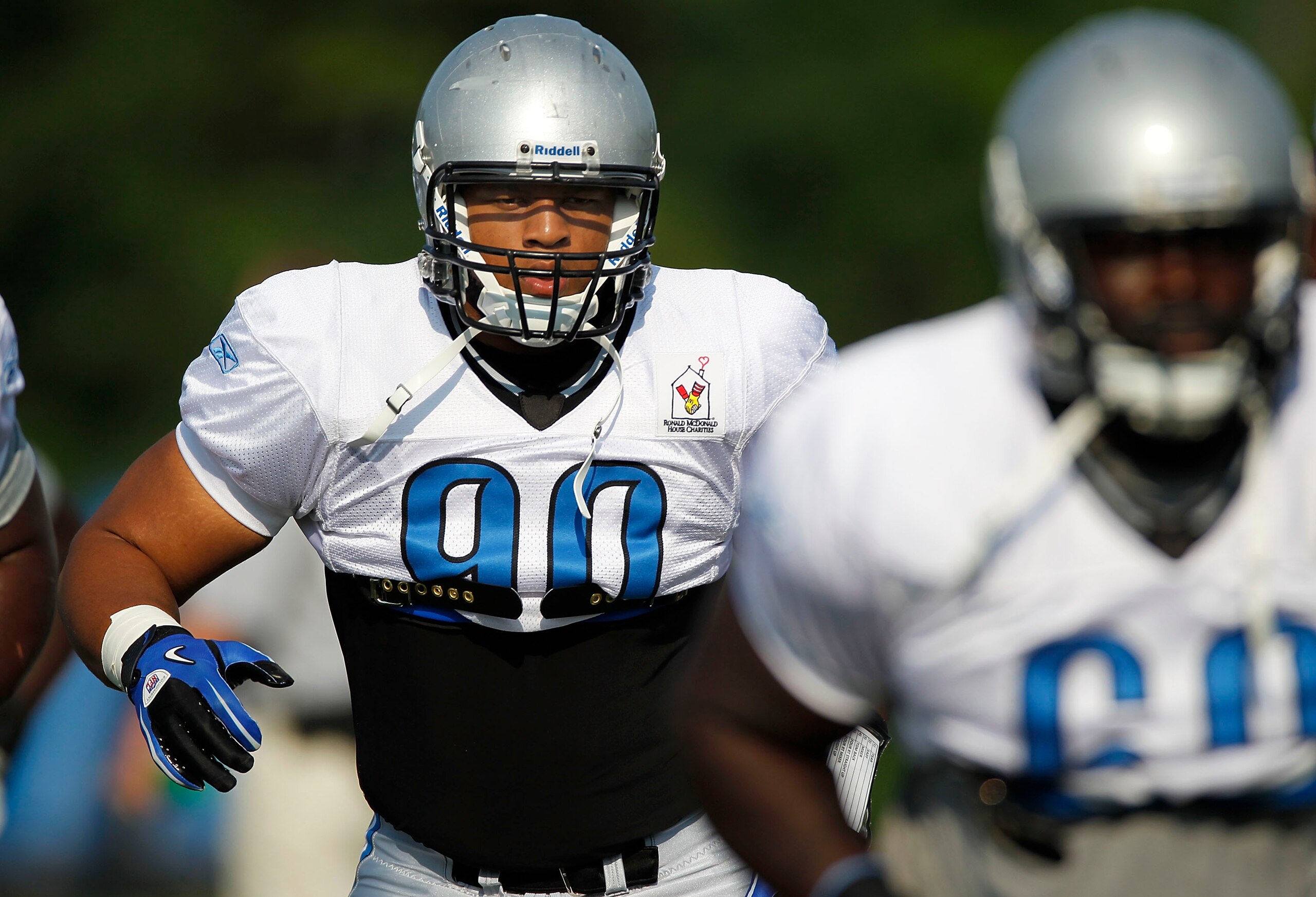 ALLEN PARK, MI - AUGUST 05:  Ndamukong Suh #90 of the Detroit Lions does a drill during training camp at the Detroit Lions Headquarters and Training Facility on August 5, 2010 in Allen Park, Michigan.  (Photo by Gregory Shamus/Getty Images)