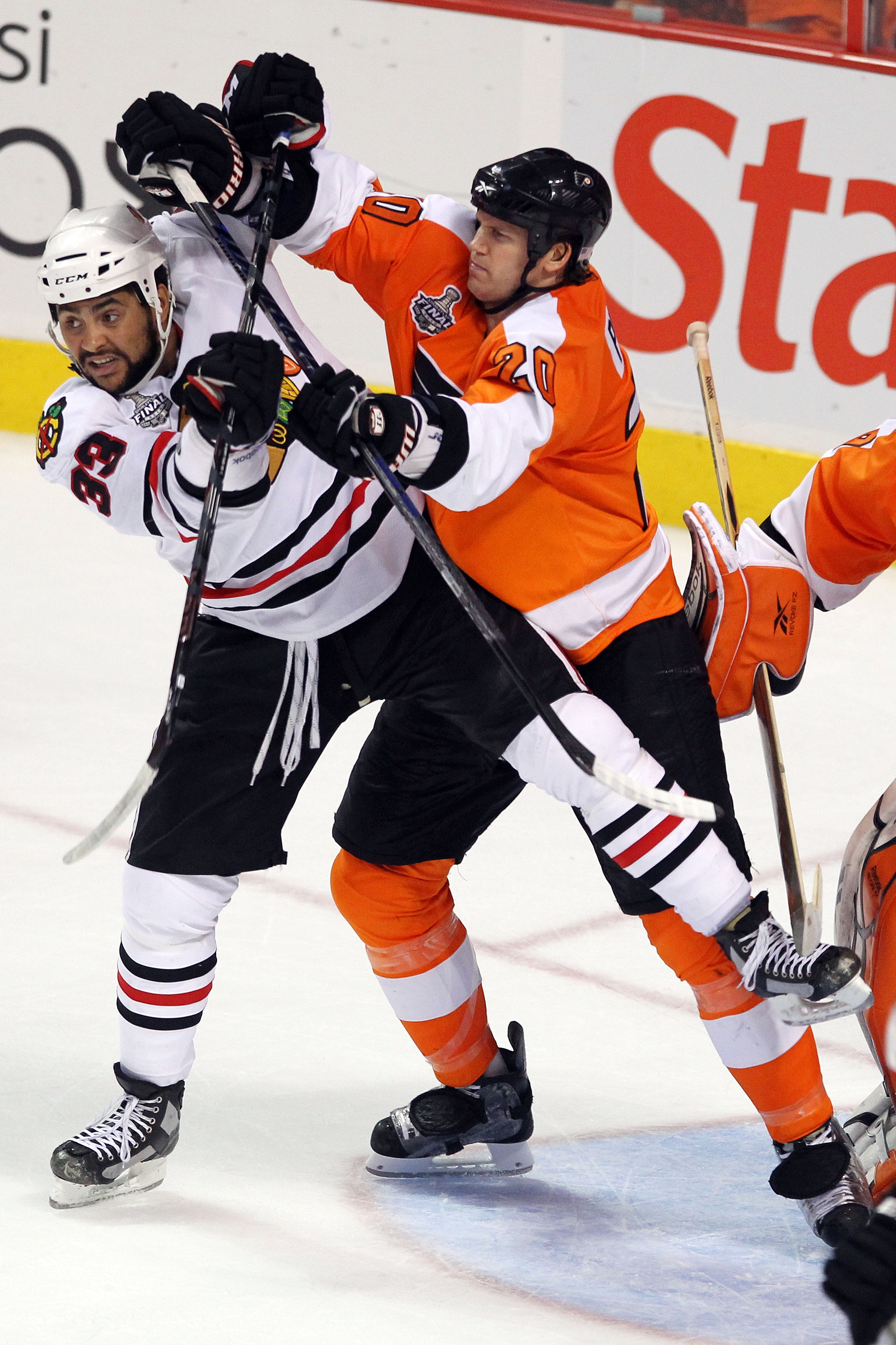 PHILADELPHIA - JUNE 04:  Dustin Byfuglien #33 of the Chicago Blackhawks and Chris Pronger #20 of the Philadelphia Flyers cross sticks in Game Four of the 2010 NHL Stanley Cup Final at Wachovia Center on June 4, 2010 in Philadelphia, Pennsylvania.  (Photo 