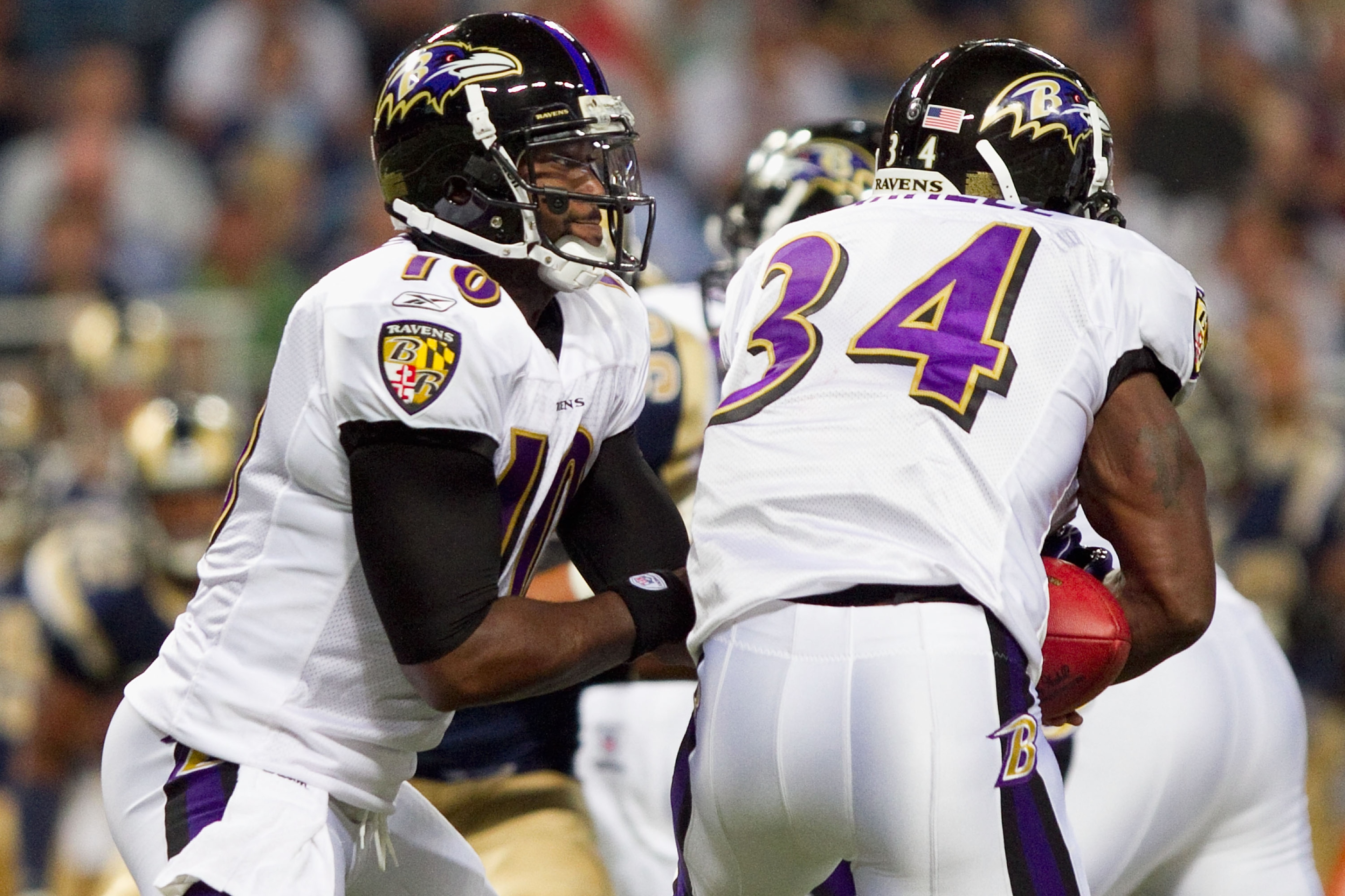 ST. LOUIS - SEPTEMBER 2: Troy Smith #10 of the Baltimore Ravens hands the ball off against the St. Louis Rams during an NFL preseason game at the Edward Jones Dome on September 2, 2010 in St. Louis, Missouri.  (Photo by Dilip Vishwanat/Getty Images)