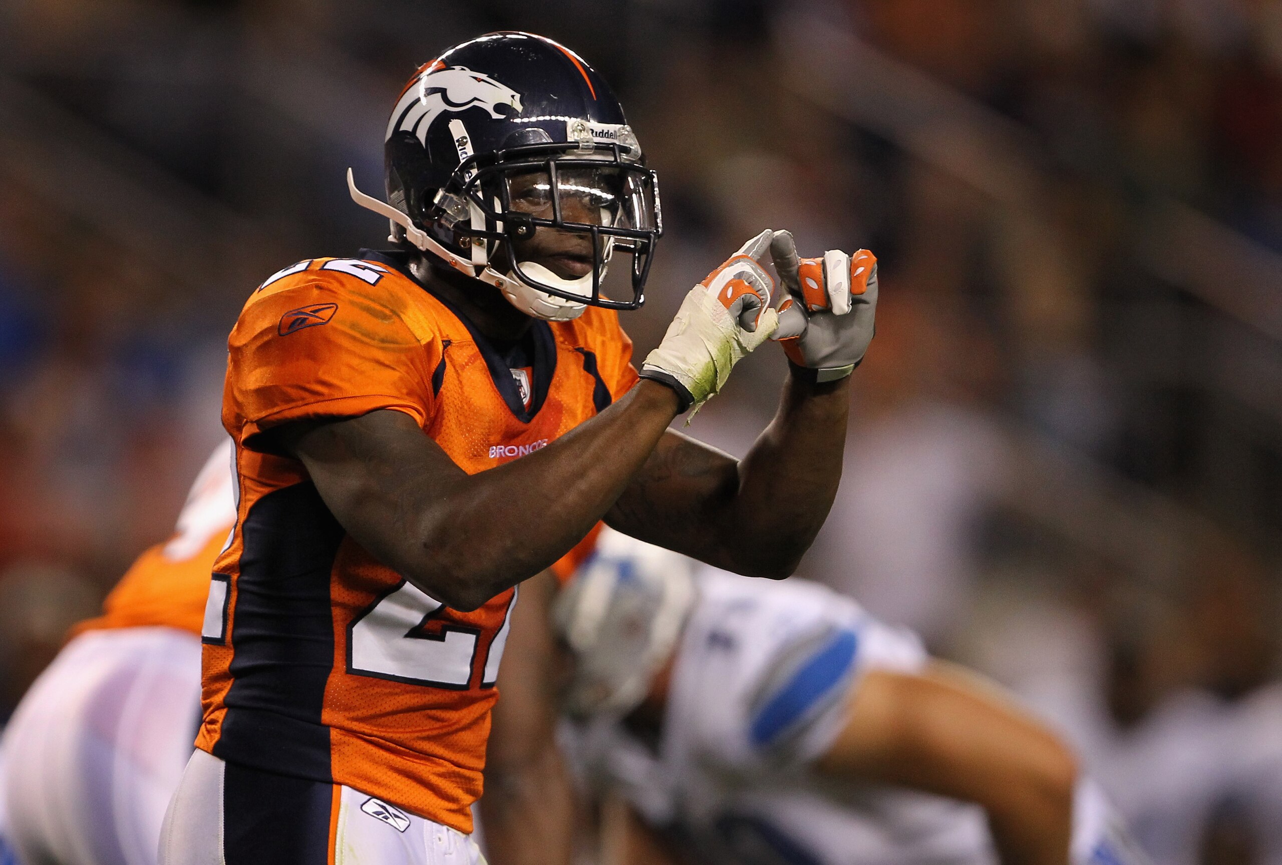 DENVER - AUGUST 21:  Cornerback Alphonso Smith #22 of the Denver Broncos signals to the bench against the Detroit Lions during preseason NFL action at INVESCO Field at Mile High on August 21, 2010 in Denver, Colorado. The Lions defeated the Broncos 25-20.