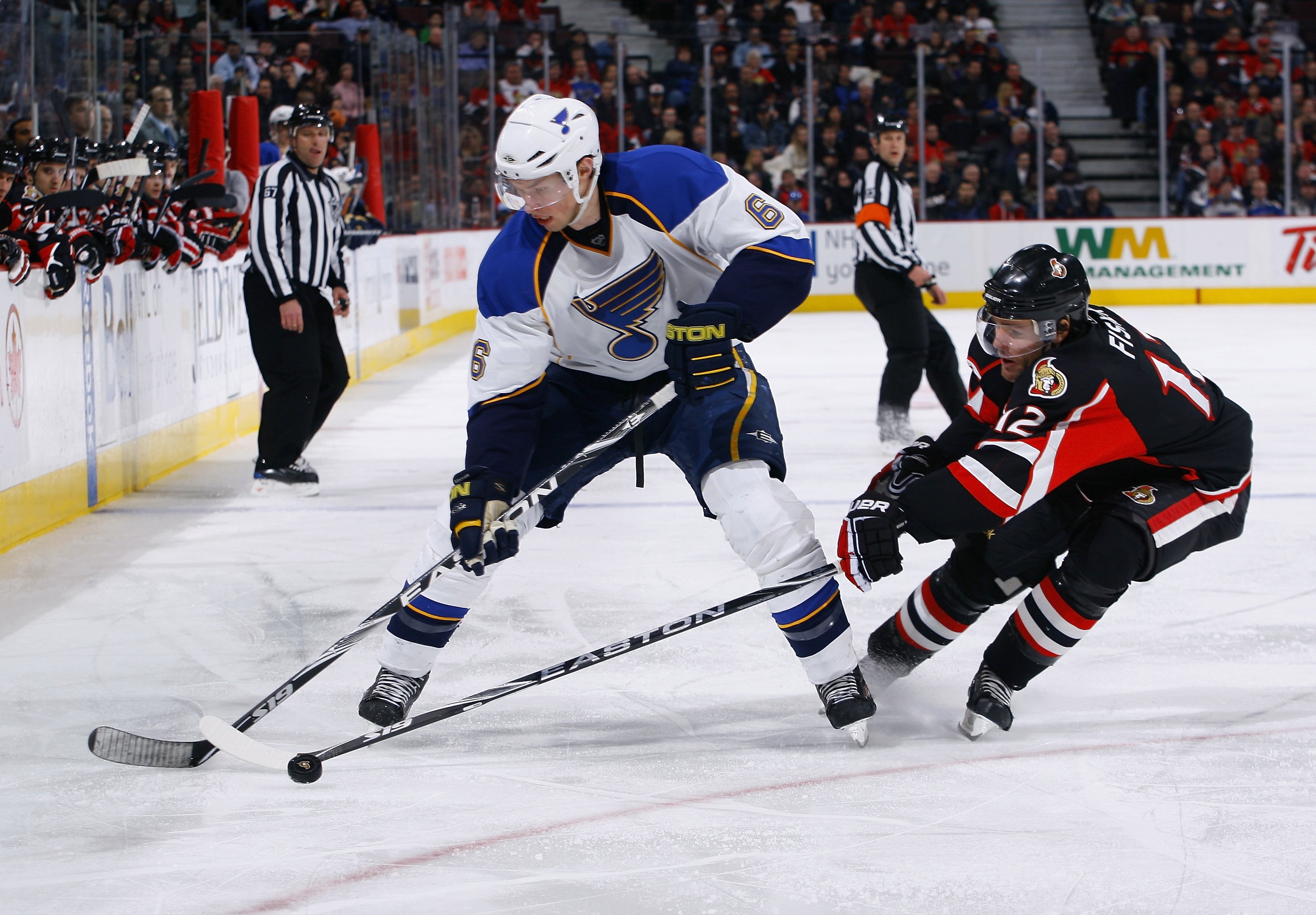 OTTAWA, ON - JANUARY 21:  Erik Johnson #6 of the St. Louis Blues loses the puck to Mike Fisher #12 of the Ottawa Senators in a game at Scotiabank Place on January 21, 2010 in Ottawa, Canada.  (Photo by Phillip MacCallum/Getty Images)