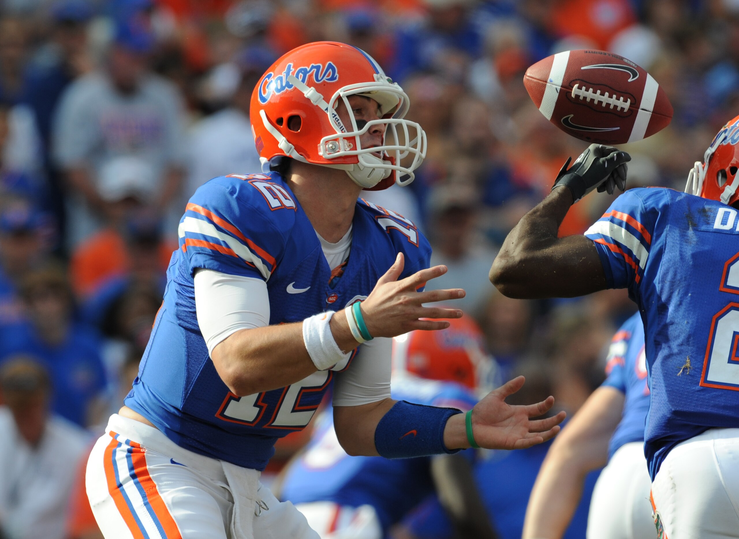 GAINESVILLE, FL - NOVEMBER 21: Quarterback John Brantley #12 of the Florida Gators bobbles a snap from center against the Florida International University Golden Panthers, November 21, 2009 at Ben Hill Griffin Stadium in Gainesville, Florida.  (Photo by A