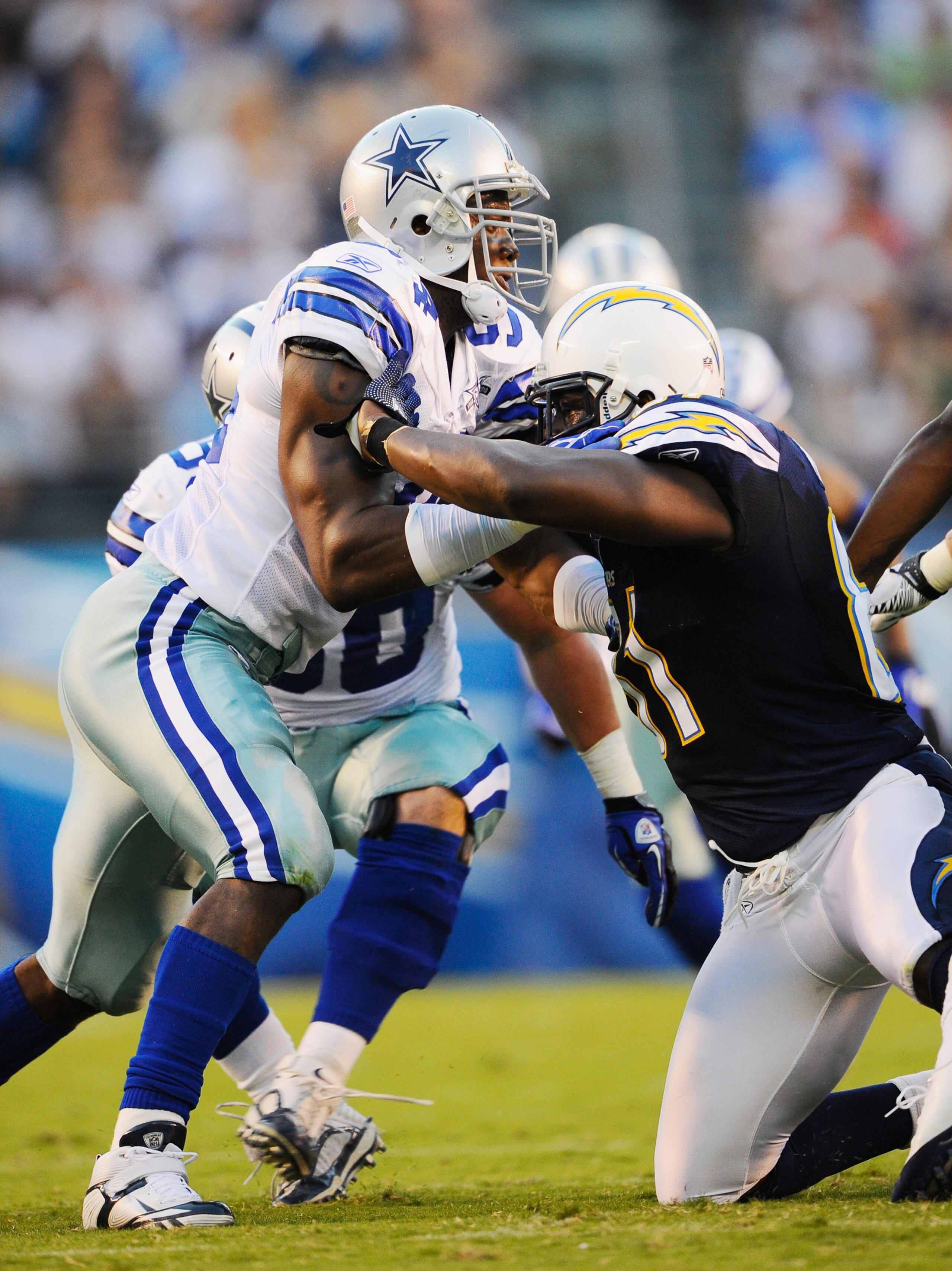 SAN DIEGO - AUGUST 21:  Line backer DeMarcus Ware #94 of the Dallas Cowboys in action against tight end Randy McMichael #81 of the San Diego Chargers at Qualcomm Stadium on August 21, 2010 in San Diego, California.  (Photo by Kevork Djansezian/Getty Image