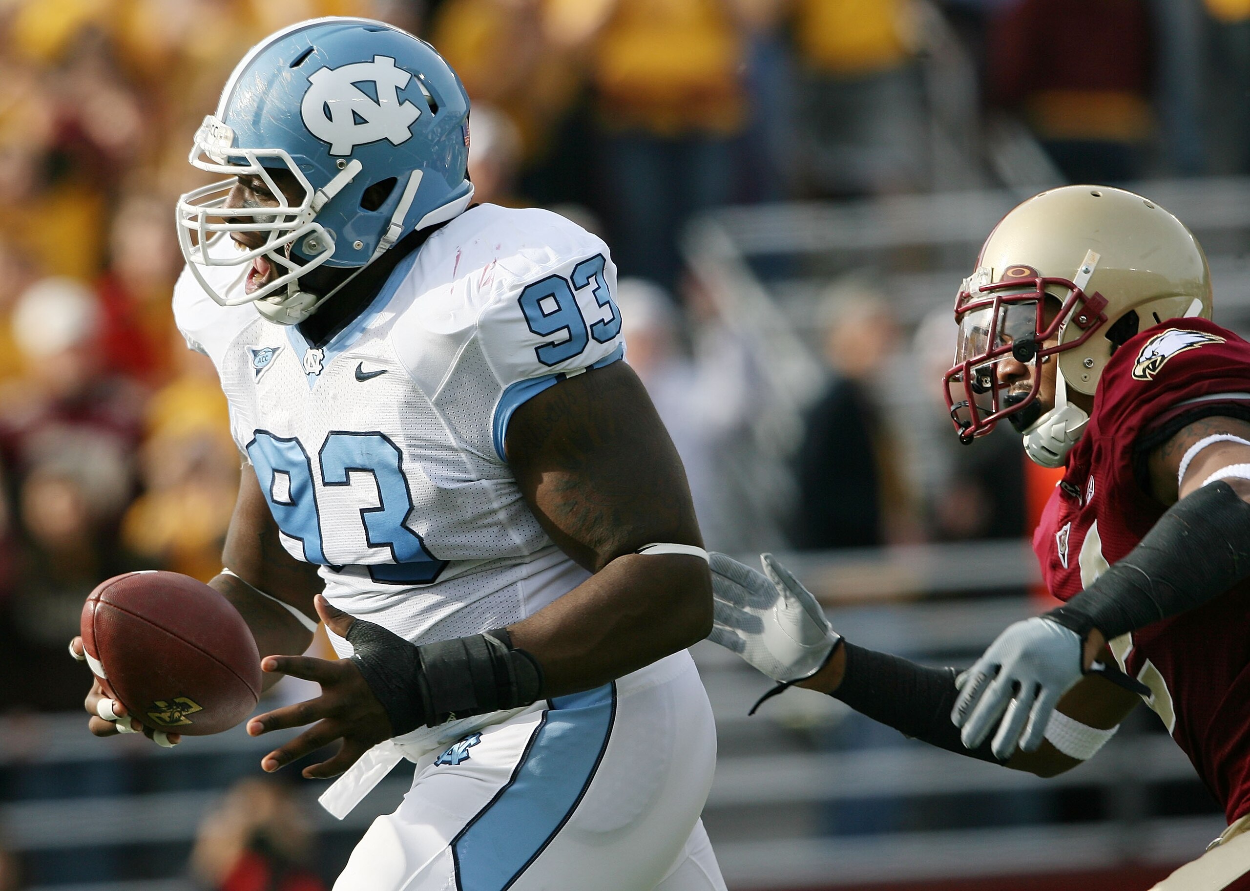 CHESTNUT HILL, MA - NOVEMBER 21:  Cam Thomas #93 of the North Carolina Tar Heels celebrates as Montel Harris #2 of the Boston College Eagles tries to make the tackle on November 21, 2009 at Alumni Stadium in Chestnut Hill, Massachusetts. Thomas recovered 