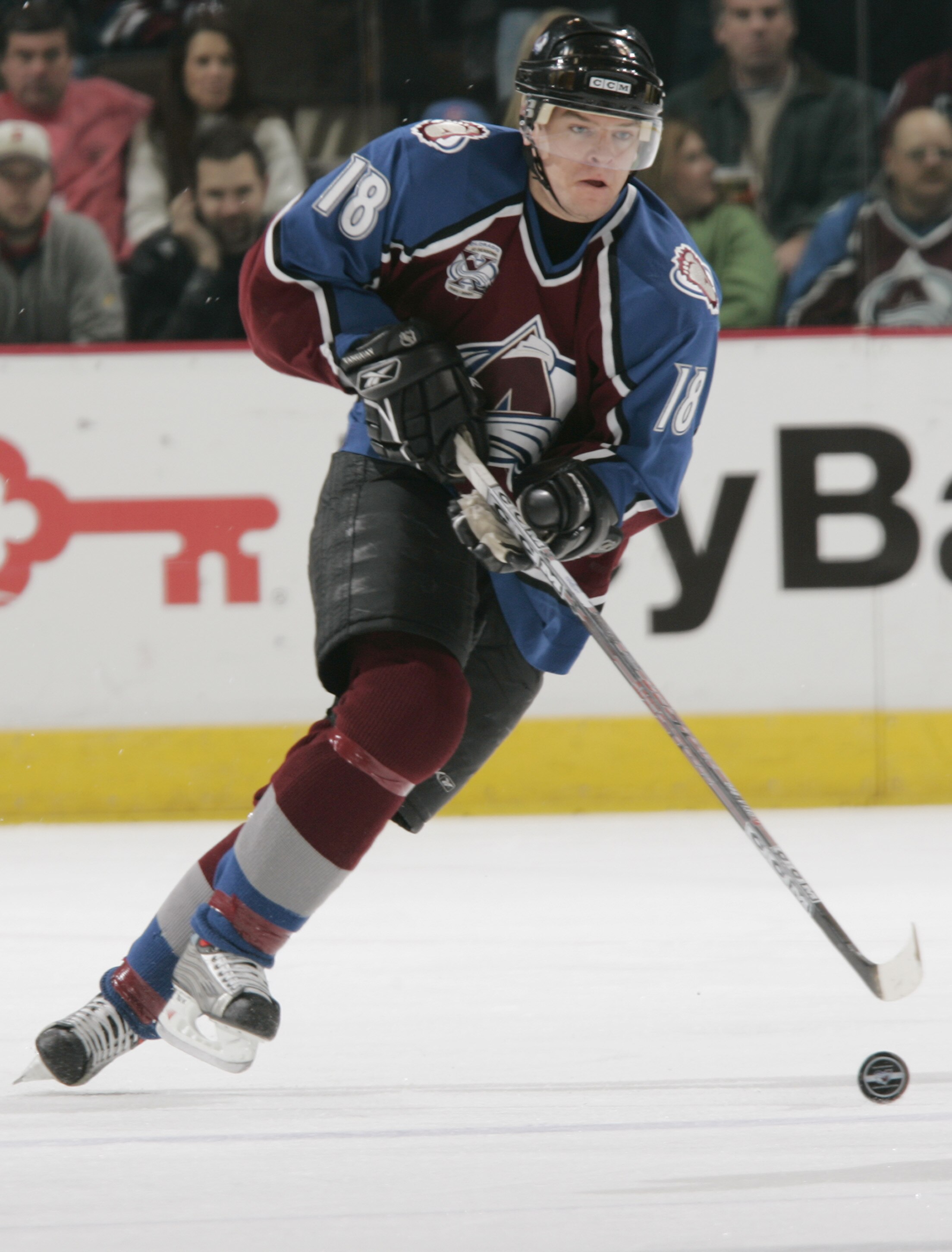 DENVER - DECEMBER 7:  Left wing Alex Tanguay #18 of the Colorado Avalanche skates with the puck during the NHL game against the Boston Bruins on December 7, 2005 at the Pepsi Center in Denver, Colorado.  The Avalanche won 4-1.  (Photo by Brian Bahr/Getty