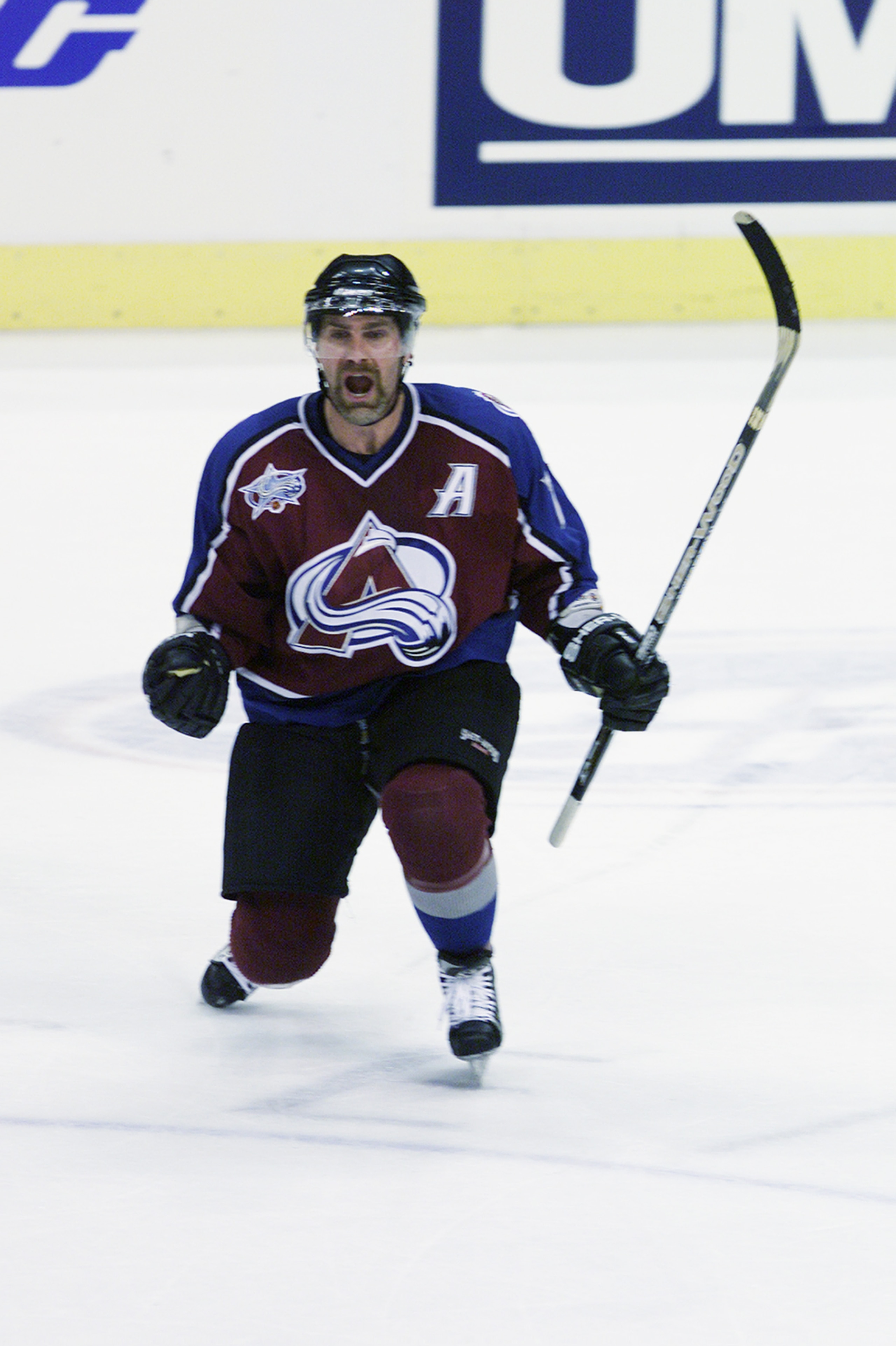 ST. LOUIS - MAY 18:  Ray Bourque #77 of the Colorado Avalanche celebrates after scoring against the St. Louis Blues in Game four of Western Conference Finals during the 2001 Stanley Cup Playoffs on May 18, 2001 at Savvis Center in St. Louis, Missouri.  Th