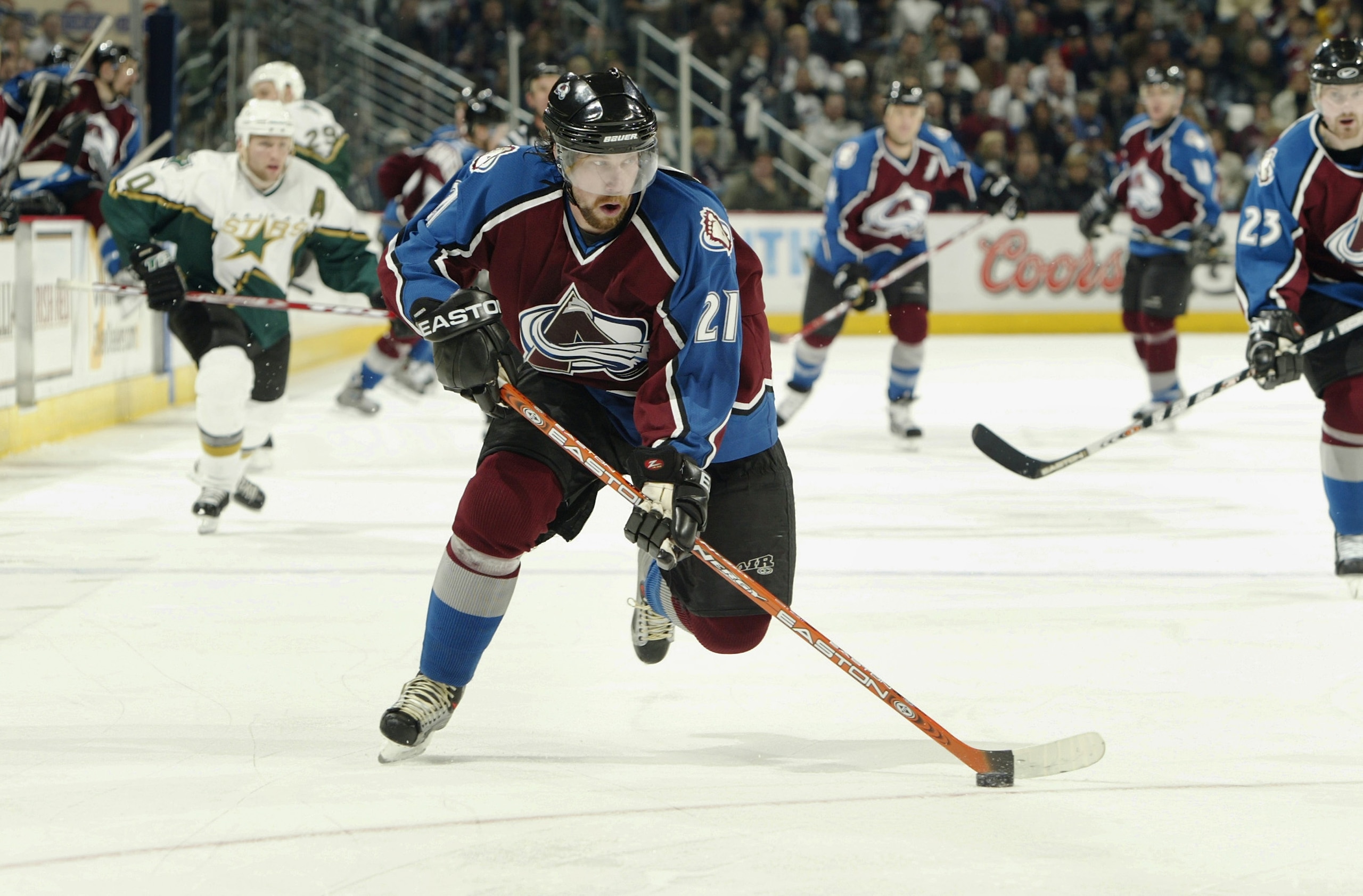 DENVER - APRIL 9:  Peter Forsberg #21 of the Colorado Avalanche breaks away against the Dallas Stars in the third period of game two of the first round of the Stanley Cup playoffs at the Pepsi Center on April 9, 2004 in Denver, Colorado.  The Avs won 5-2.