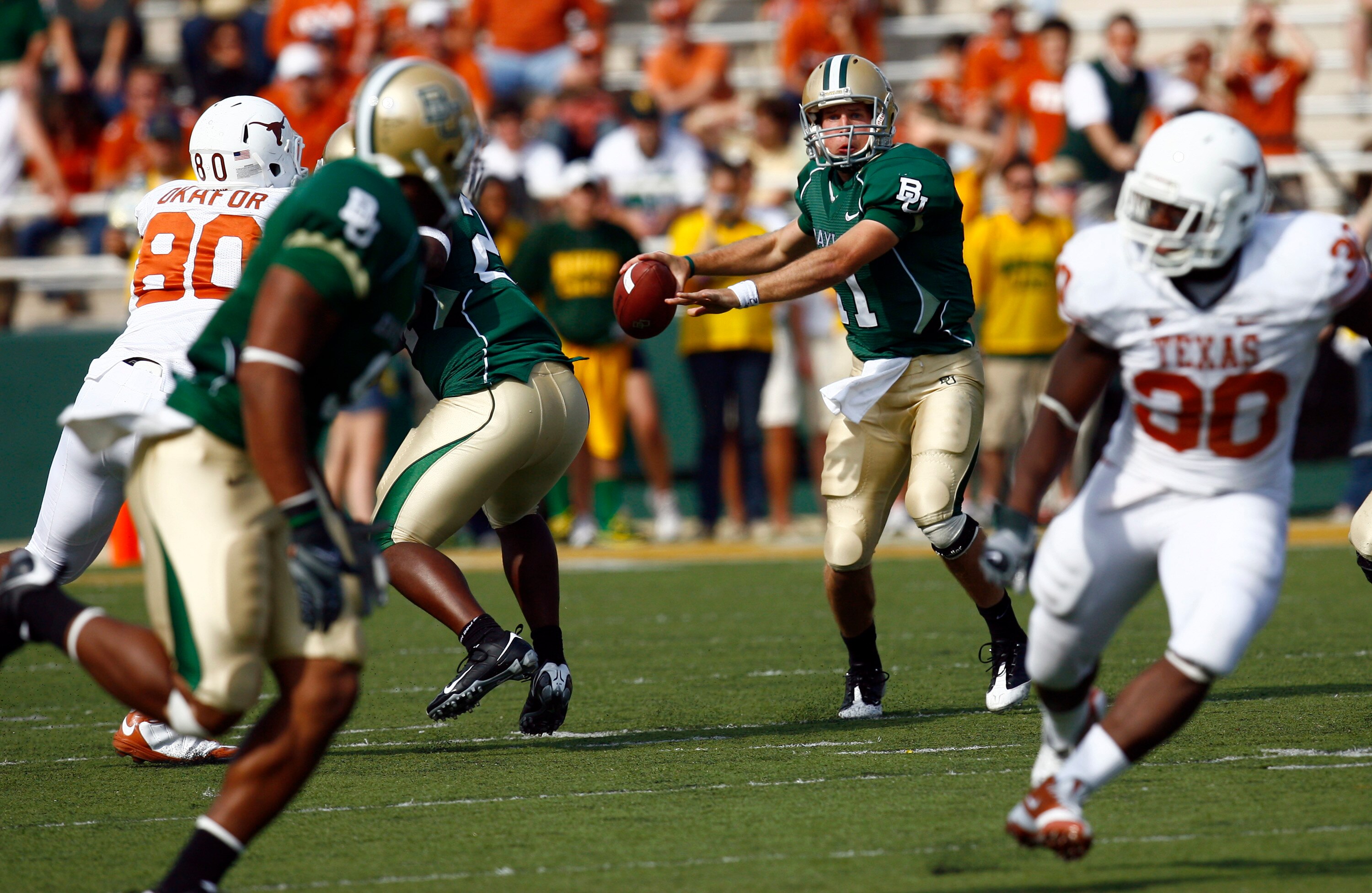 WACO, TX - NOVEMBER 14:  Quarterback Nick Florence #11 of the Baylor Bears drops back to pass during the first half against the Texas Longhorns on November 14, 2009 at Floyd Casey Stadium in Waco, Texas.  The Longhorns beat the Bears 47-14.  (Photo by Tom