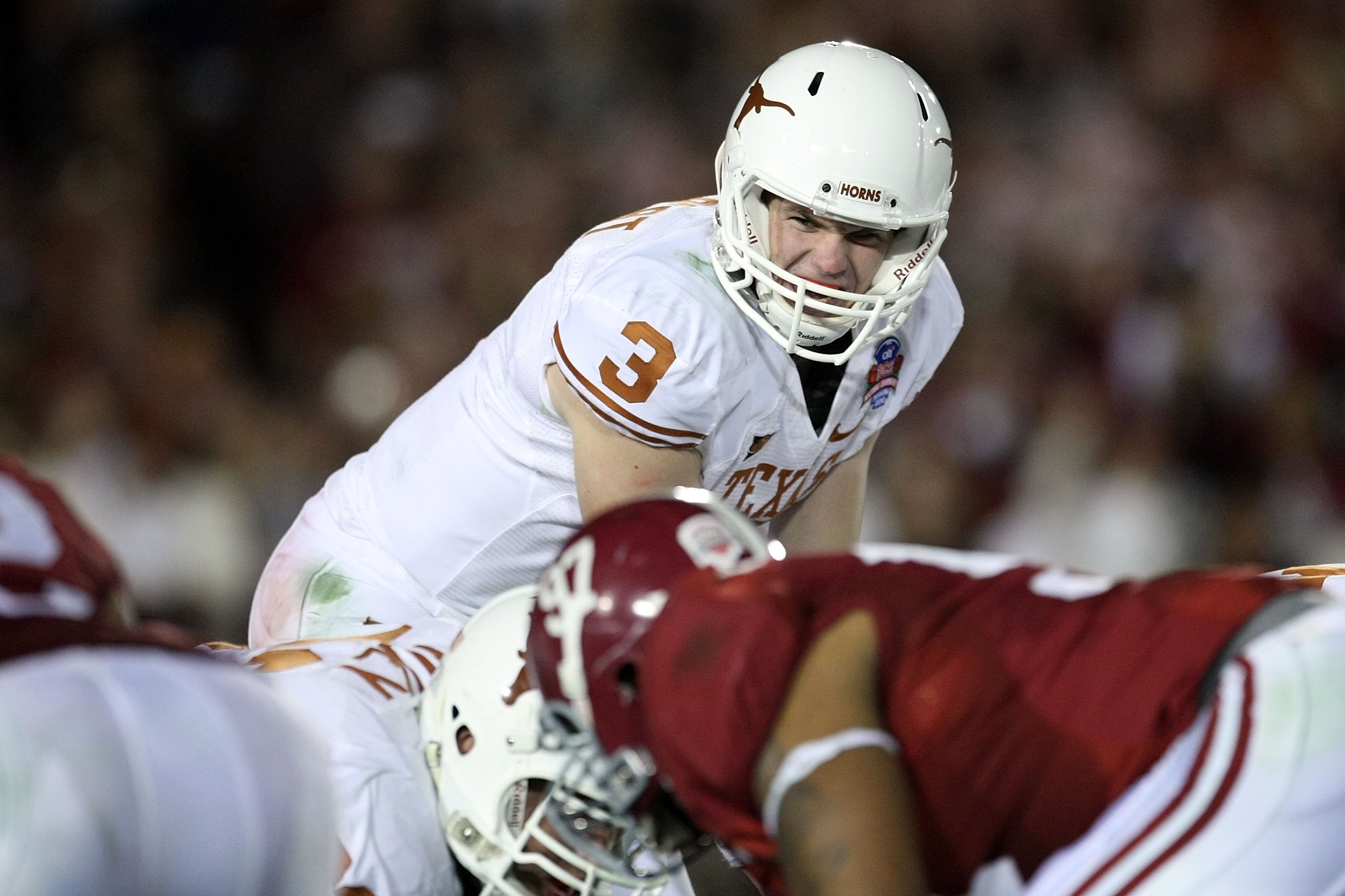 PASADENA, CA - JANUARY 07:  Quarterback Garrett Gilbert #3 of the Texas Longhorns under center against the Alabama Crimson Tide during the Citi BCS National Championship game at the Rose Bowl on January 7, 2010 in Pasadena, California.  (Photo by Stephen