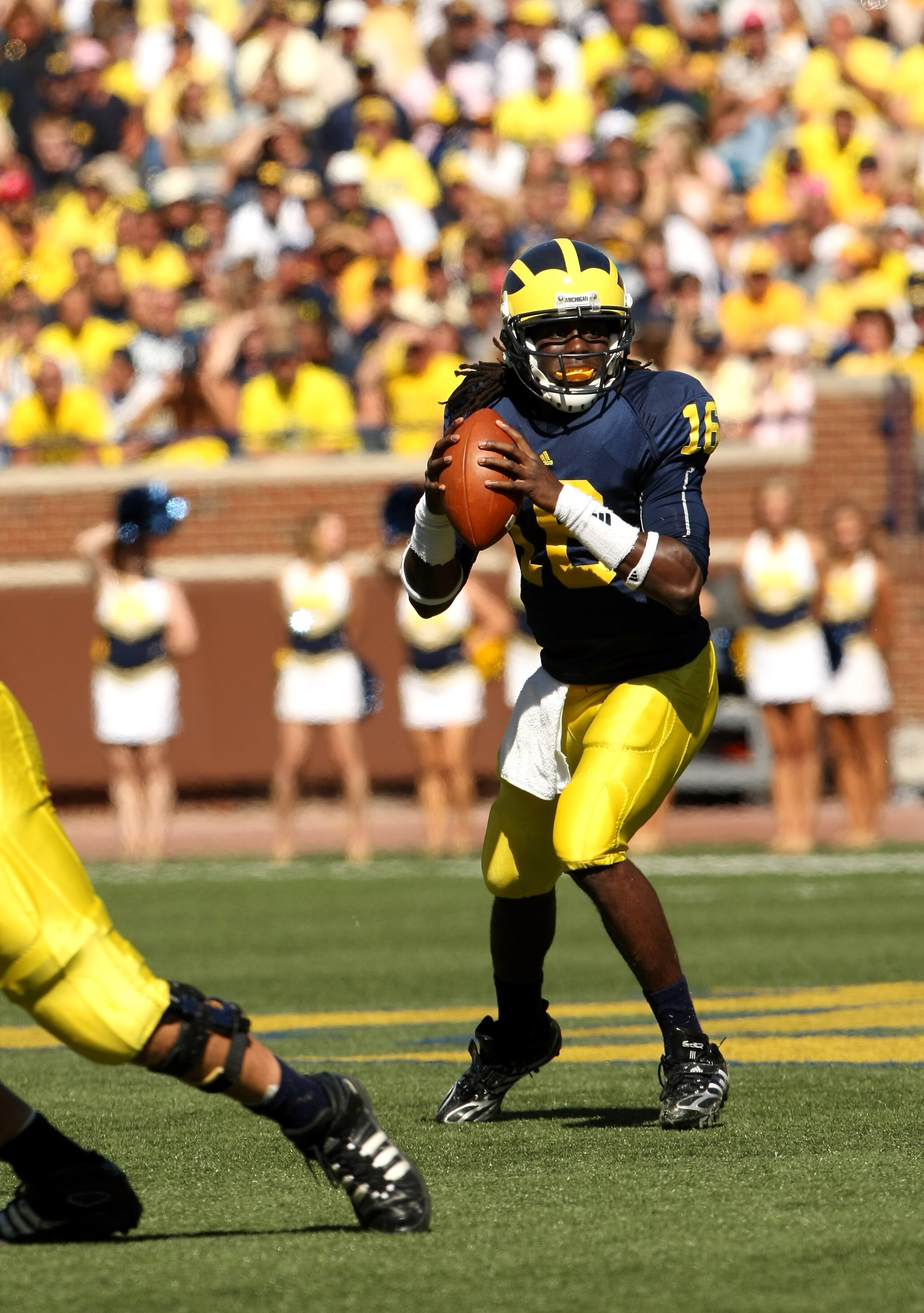 ANN ARBOR, MI - SEPTEMBER 19:  Quarterback Denard Robinson #16 of the Michigan Wolverines drops back to pass against the Eastern Michigan Eagles at Michigan Stadium on September 19, 2009 in Ann Arbor, Michigan.  Michigan won 45-17.  (Photo by Stephen Dunn