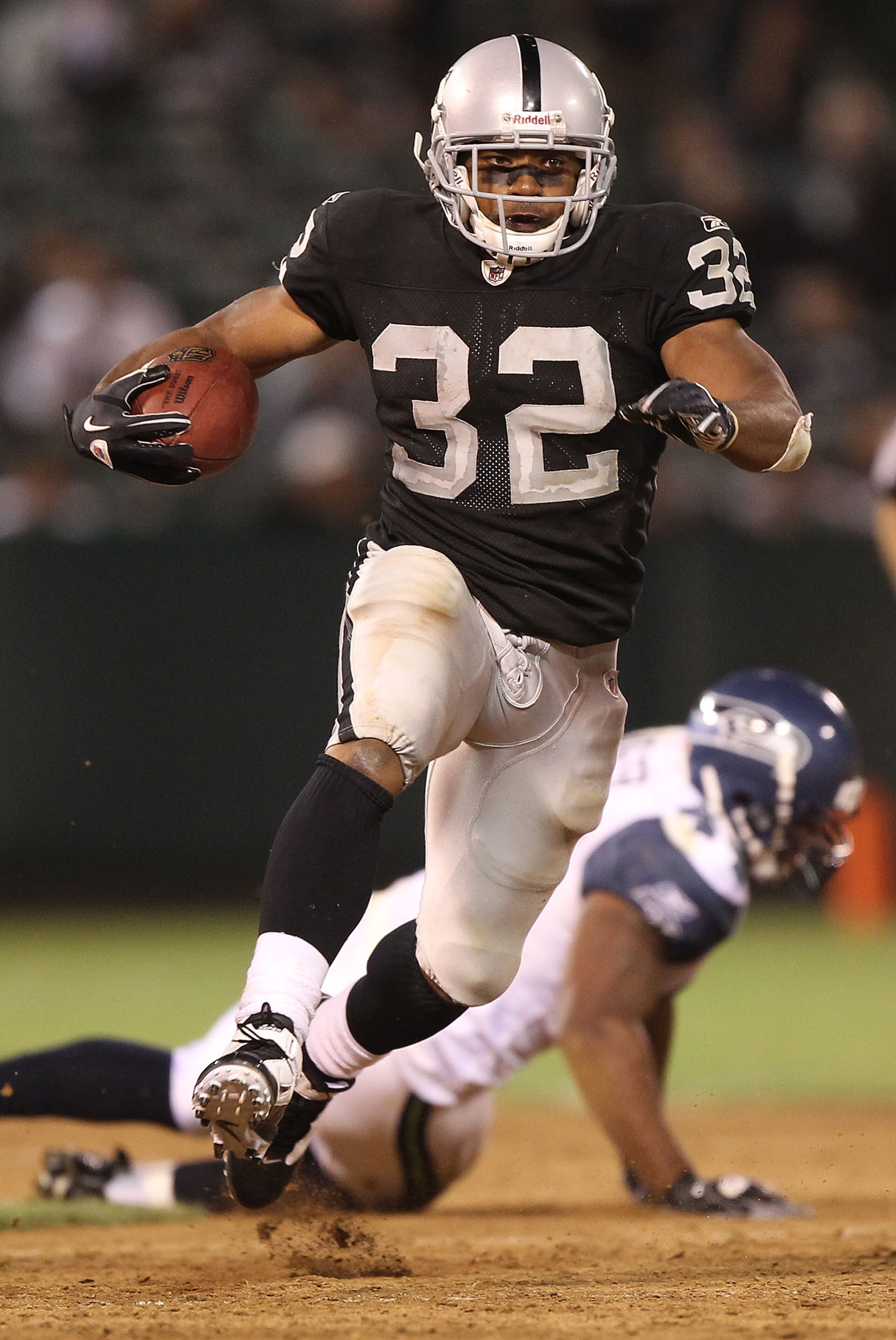 OAKLAND, CA - SEPTEMBER 02: Michael Bennett #32 of the Oakland Raiders runs against the Seattle Seahawks during an NFL preseason game at Oakland-Alameda County Coliseum on September 2, 2010 in Oakland, California. (Photo by Jed Jacobsohn/Getty Images) OAKLAND, CA - SEPTEMBER 02: Michael Bennett #32 of the Oakland Raiders runs against the Seattle Seahawks during an NFL preseason game at Oakland-Alameda County Coliseum on September 2, 2010 in Oakland, California. (Photo by Jed Jacobsohn/Getty Images)