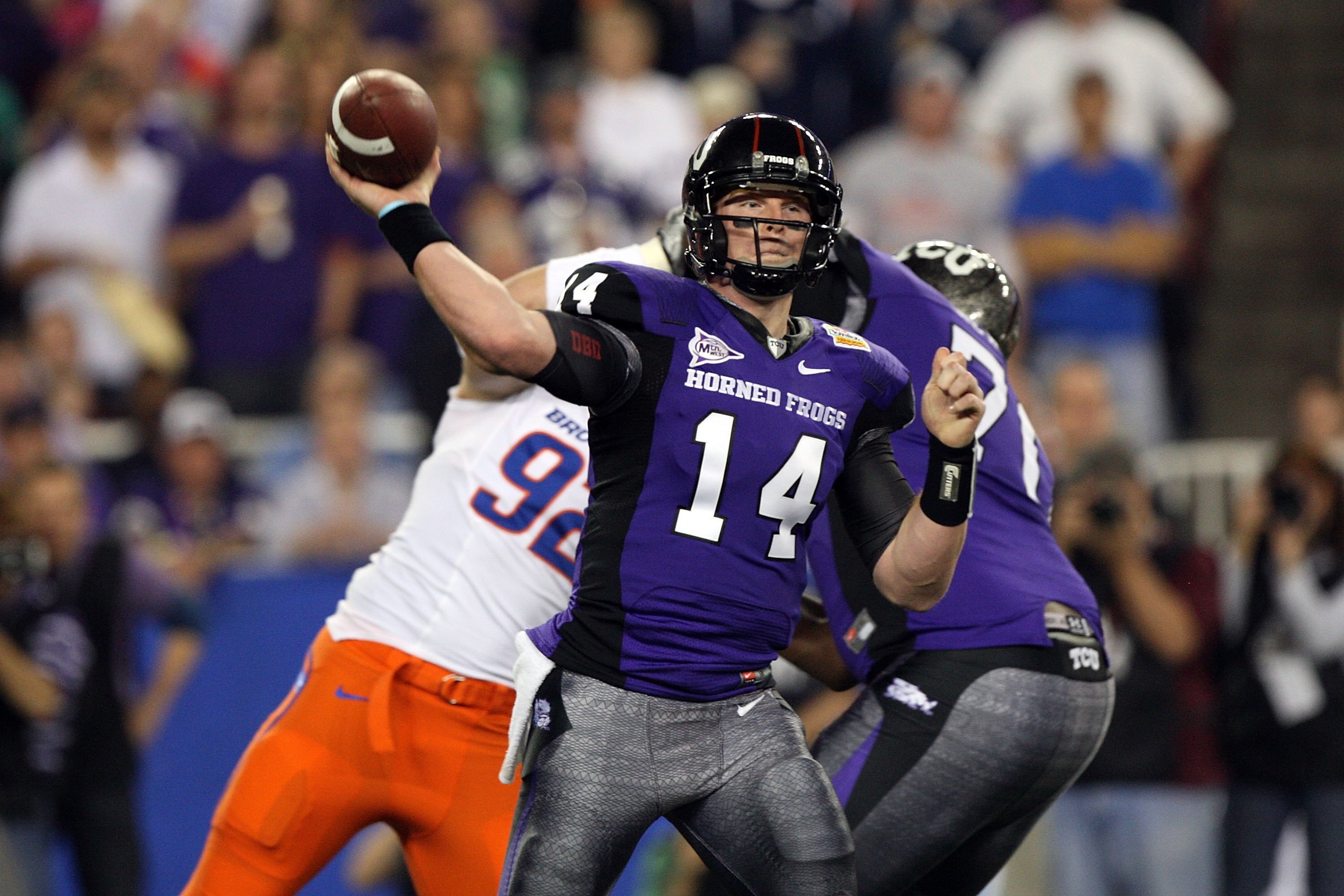 GLENDALE, AZ - JANUARY 04:  Quarterback Andy Dalton #14 of the TCU Horned Frogs passes the ball against the Boise State Broncos during the Tostitos Fiesta Bowl at the Universtity of Phoenix Stadium on January 4, 2010 in Glendale, Arizona.  (Photo by Jed J