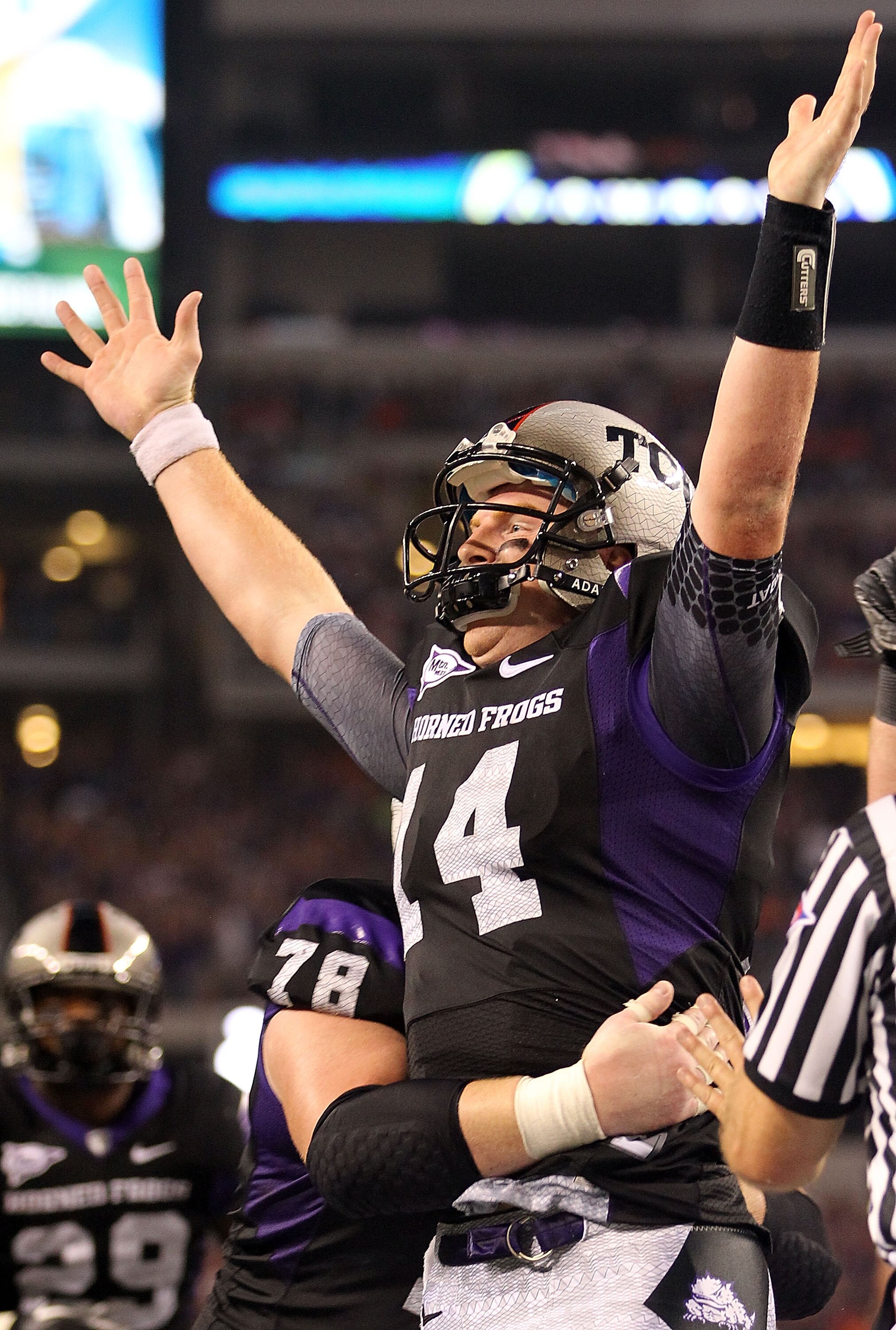 ARLINGTON, TX - SEPTEMBER 04:  Quarterback Andy Dalton #14 of the TCU Horned Frogs celebrates a touchdown run against the Oregon State Beavers in the third quarter at Cowboys Stadium on September 4, 2010 in Arlington, Texas.  (Photo by Ronald Martinez/Get