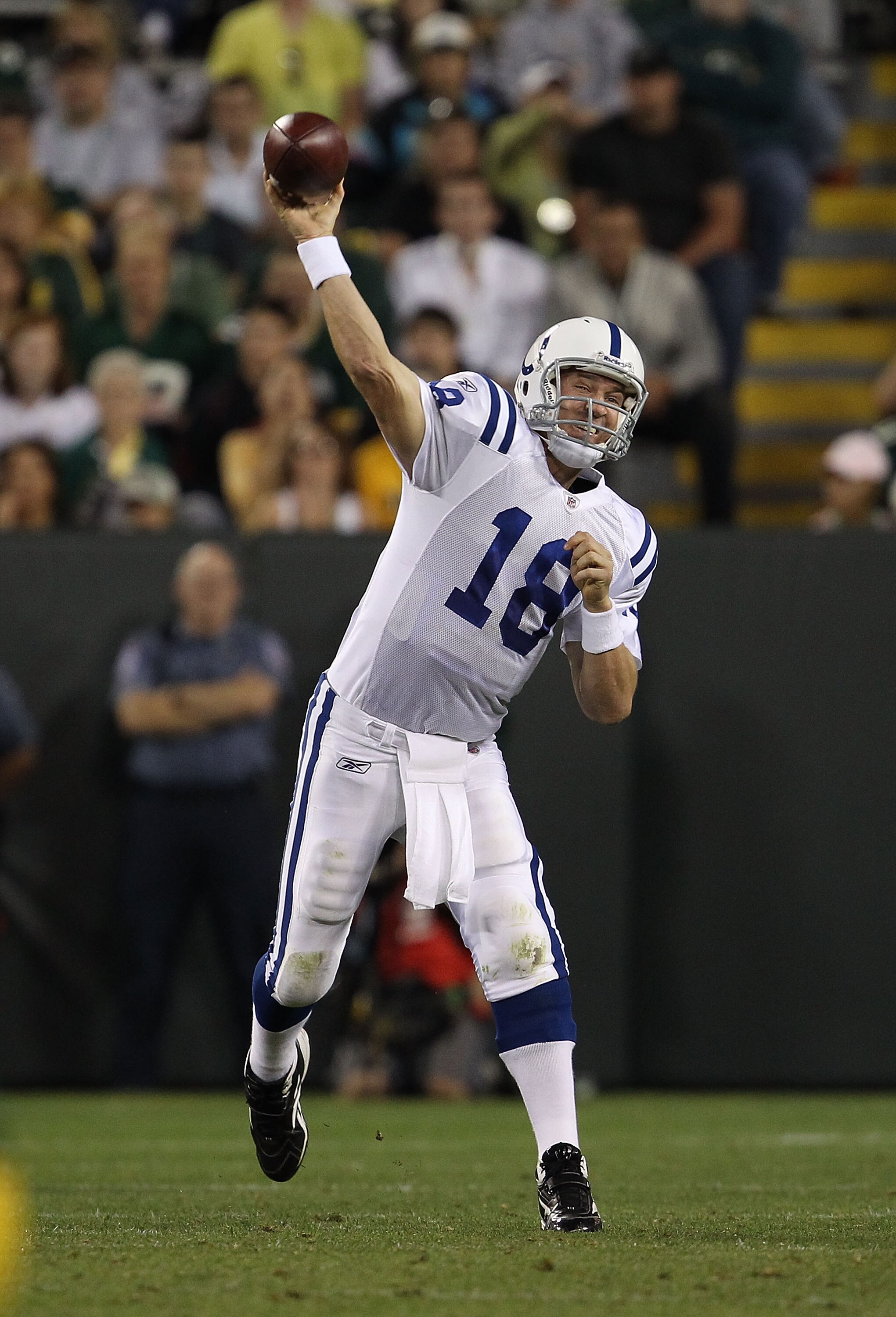 GREEN BAY, WI - AUGUST 26: Peyton Manning #18 of the Indianapolis Colts throws a pass against the Green Bay Packers during a preseason game at Lambeau Field on August 26, 2010 in Green Bay, Wisconsin. The Packers defeated the Colts 59-24. (Photo by Jonath