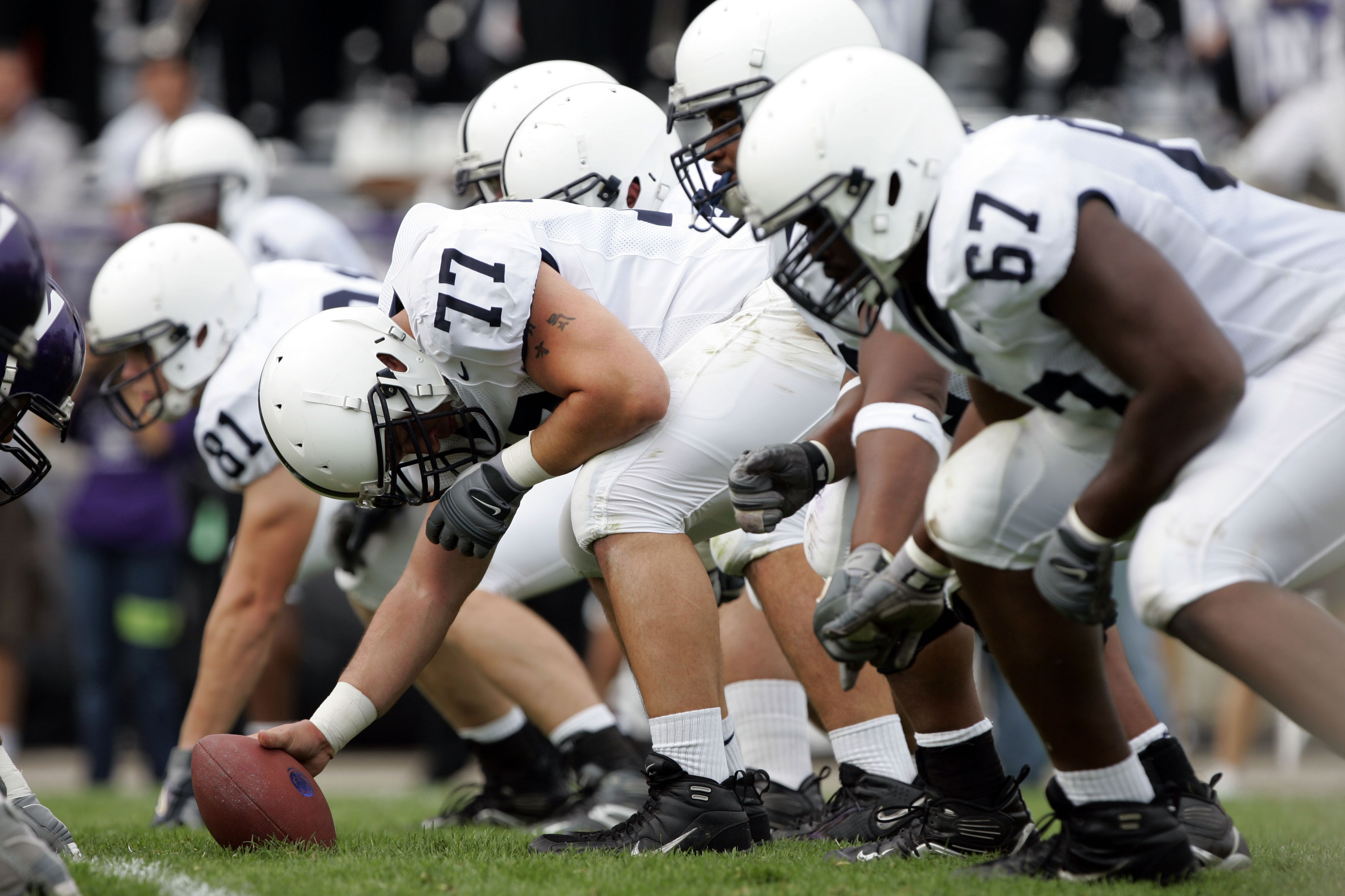 EVANSTON, IL - SEPTEMBER 24:  Center E.Z. Smith #77 of the Penn State Nittany Lions gets set to snap the ball against the Northwestern Wildcats September 24, 2005 at Ryan Field in Evanston, Illinois.  Penn State won 34-29.   (Photo by Brian Bahr/Getty Ima