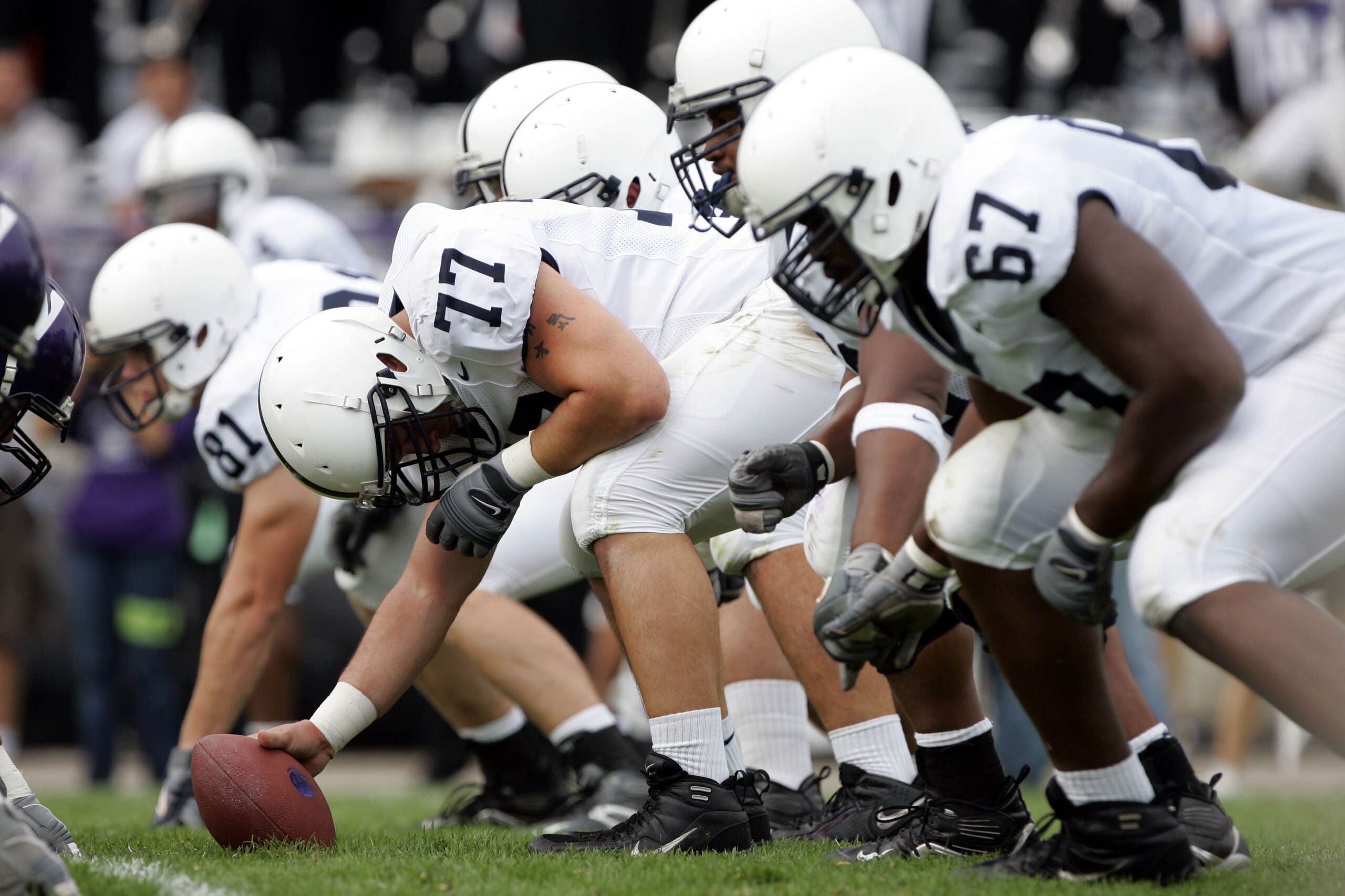 EVANSTON, IL - SEPTEMBER 24:  Center E.Z. Smith #77 of the Penn State Nittany Lions gets set to snap the ball against the Northwestern Wildcats September 24, 2005 at Ryan Field in Evanston, Illinois.  Penn State won 34-29.   (Photo by Brian Bahr/Getty Ima