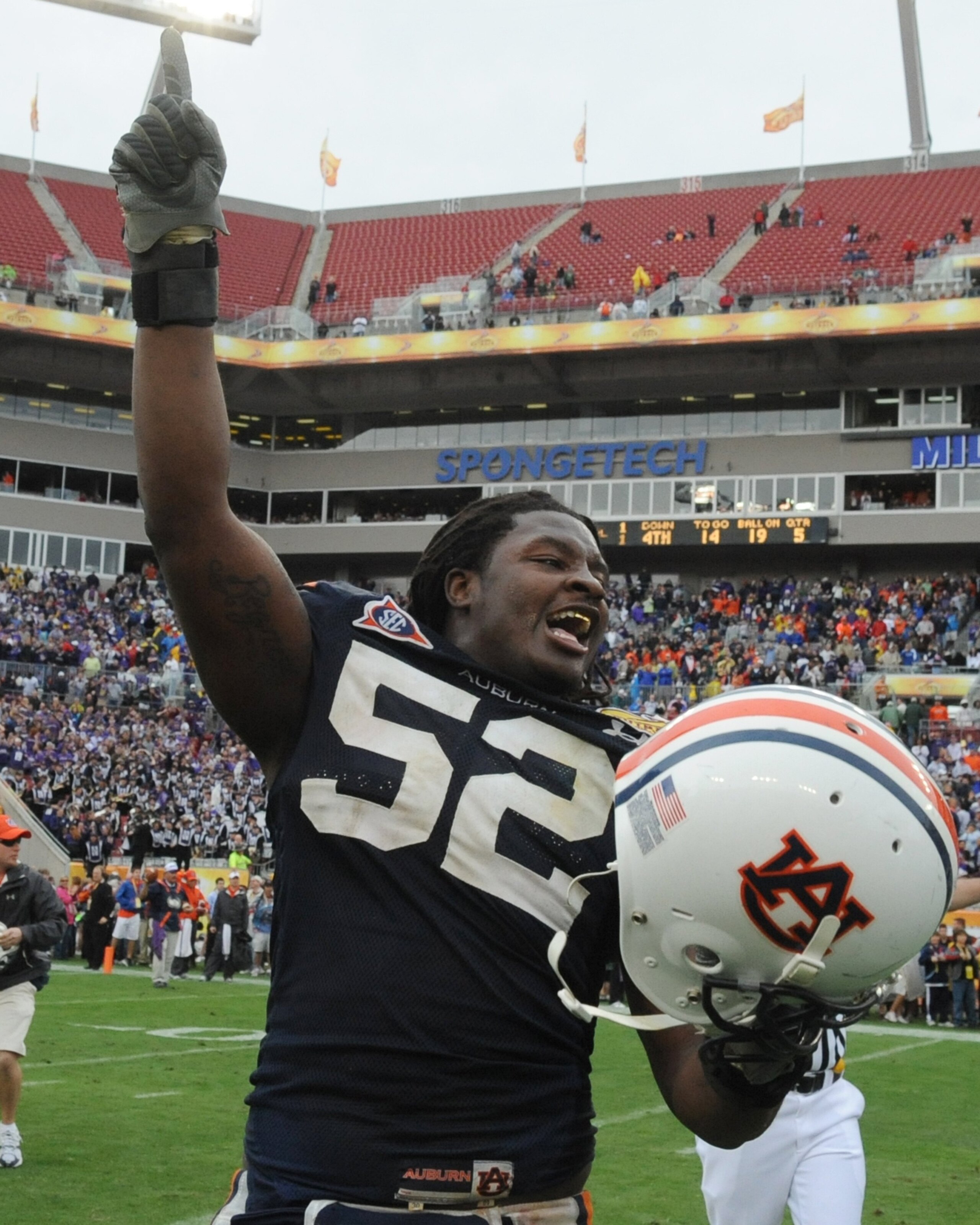 TAMPA, FL - JANUARY 1: Defensive end Antonio Coleman #52 of the Auburn Tigers celebrates a victory against the Northwestern Wildcats in the Outback Bowl January 1, 2010 at Raymond James Stadium in Tampa, Florida. (Photo by Al Messerschmidt/Getty Images) TAMPA, FL - JANUARY 1: Defensive end Antonio Coleman #52 of the Auburn Tigers celebrates a victory against the Northwestern Wildcats in the Outback Bowl January 1, 2010 at Raymond James Stadium in Tampa, Florida. (Photo by Al Messerschmidt/Getty Images)