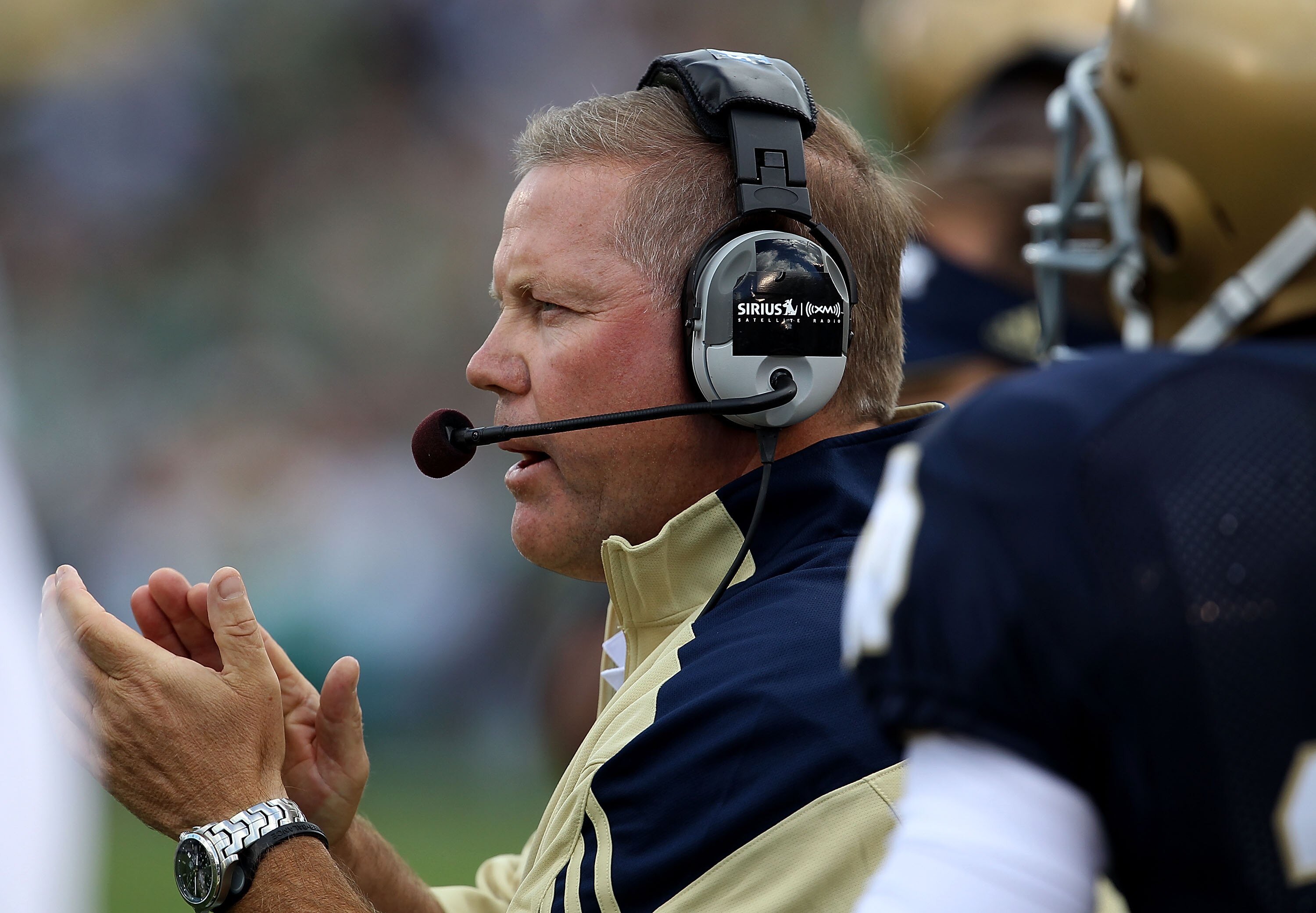 SOUTH BEND, IN - SEPTEMBER 04: Head coach Brian Kelly of the Notre Dame Fighting Irish encourages his team against the Purdue Boilermakers at Notre Dame Stadium on September 4, 2010 in South Bend, Indiana. (Photo by Jonathan Daniel/Getty Images)