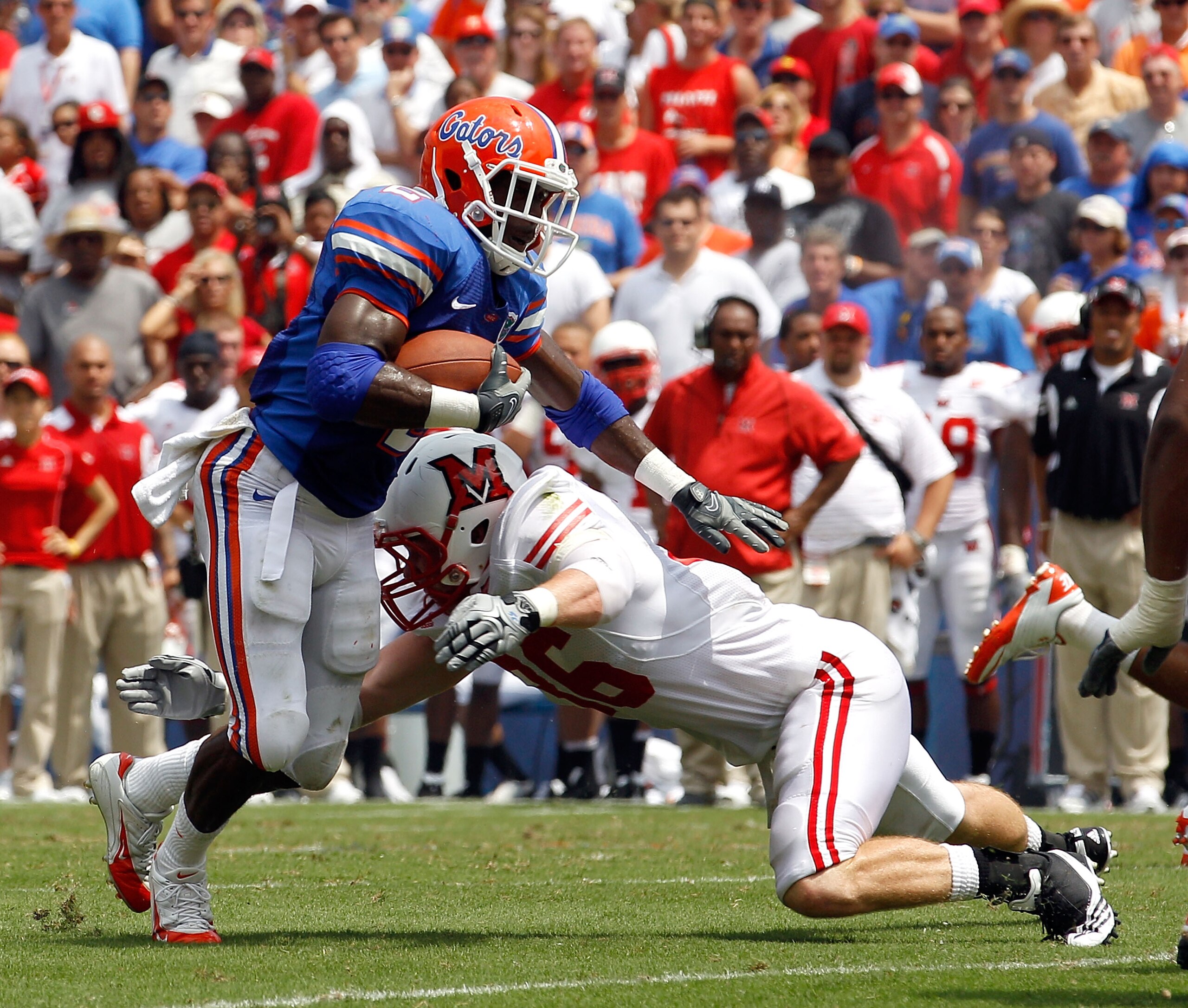 GAINESVILLE, FL - SEPTEMBER 04:  Jeffery Demps #2 of the Florida Gators attempts to run past Luke Kelly #36 of the Miami University RedHawks at Ben Hill Griffin Stadium on September 4, 2010 in Gainesville, Florida.  (Photo by Sam Greenwood/Getty Images)