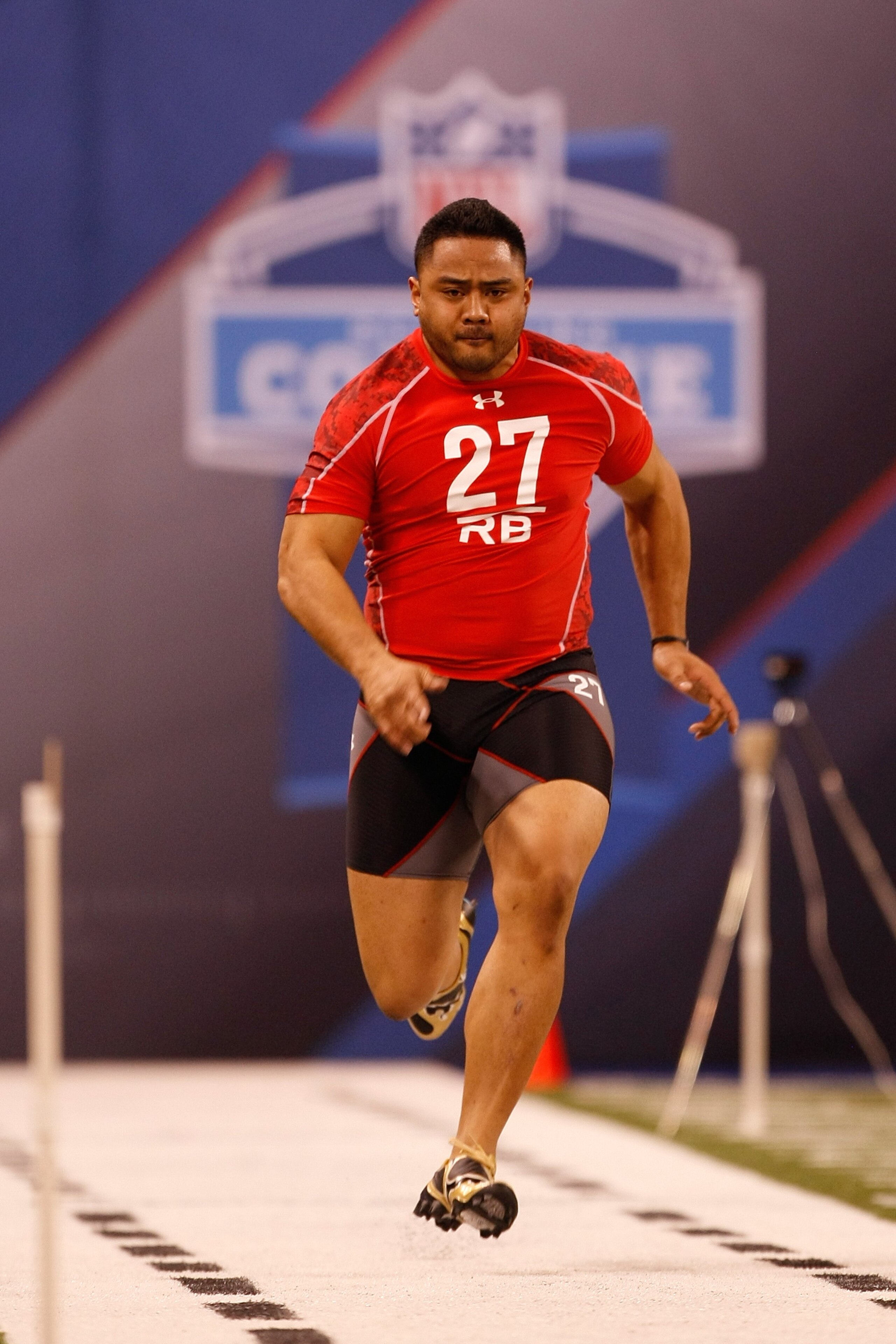 INDIANAPOLIS, IN - FEBRUARY 28: Running back Manase Tonga of Brigham Young runs the 40 yard dash during the NFL Scouting Combine presented by Under Armour at Lucas Oil Stadium on February 28, 2010 in Indianapolis, Indiana. (Photo by Scott Boehm/Getty Imag