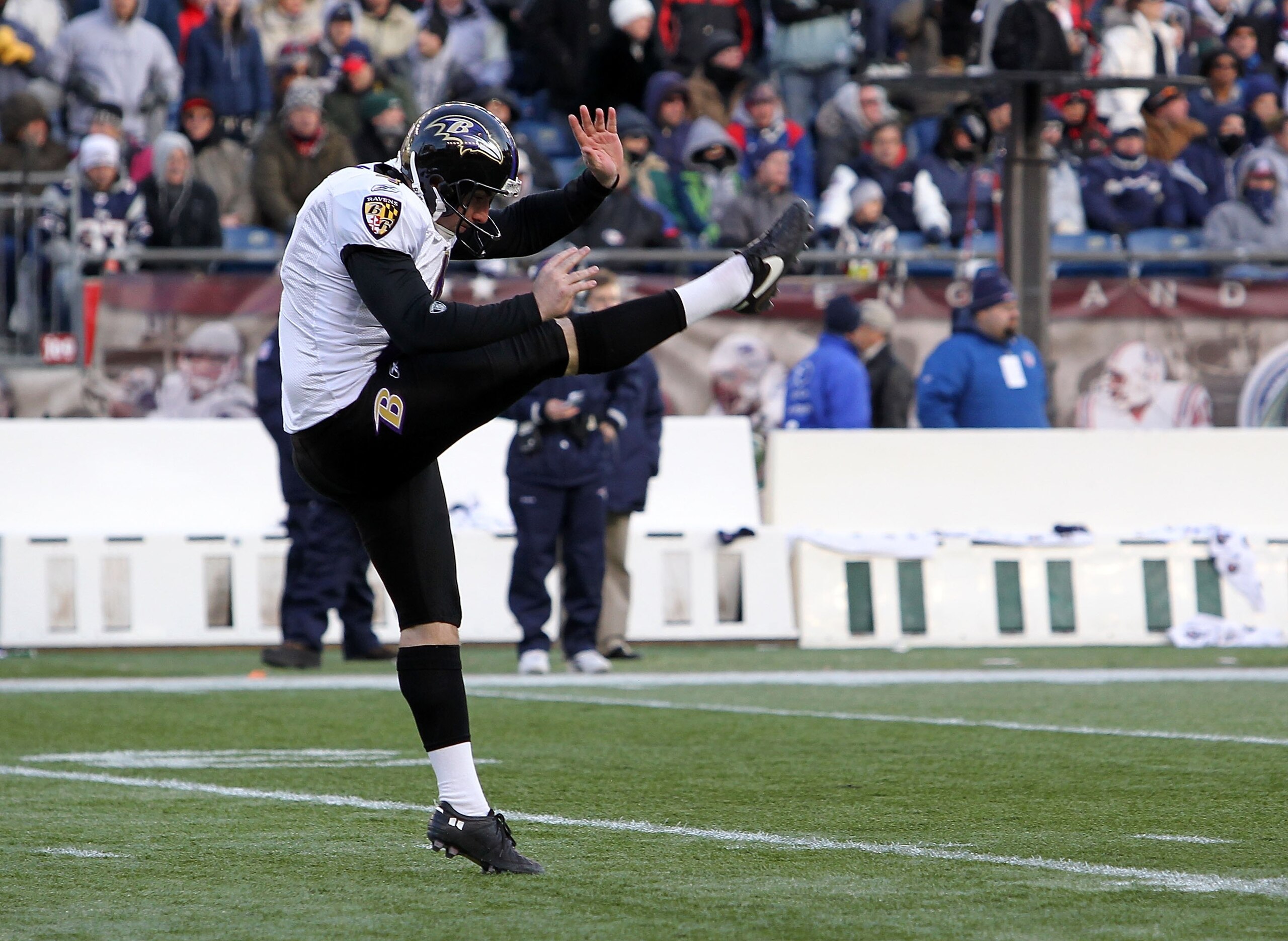 FOXBORO, MA - JANUARY 10:  Sam Koch #4 of the Baltimore Ravens punts the ball against the New England Patriots during the 2010 AFC wild-card playoff game at Gillette Stadium on January 10, 2010 in Foxboro, Massachusetts.  (Photo by Jim Rogash/Getty Images