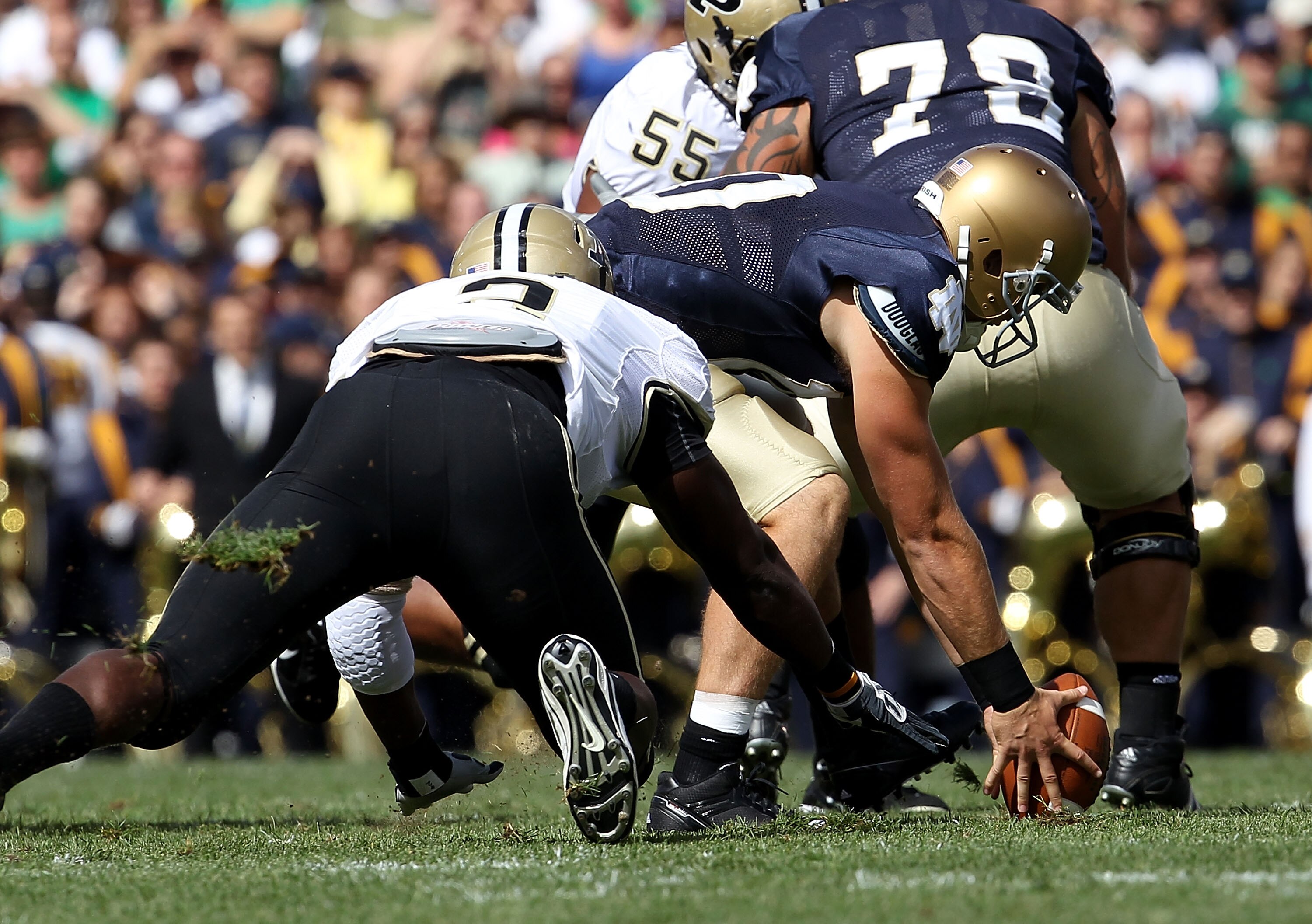 SOUTH BEND, IN - SEPTEMBER 04: Dayne Crist #10 of the Notre Dame Fighting Irish recovers his own fumble under pressure from Gerald Gooden #2 of the Purdue Boilermakers at Notre Dame Stadium on September 4, 2010 in South Bend, Indiana. (Photo by Jonathan D