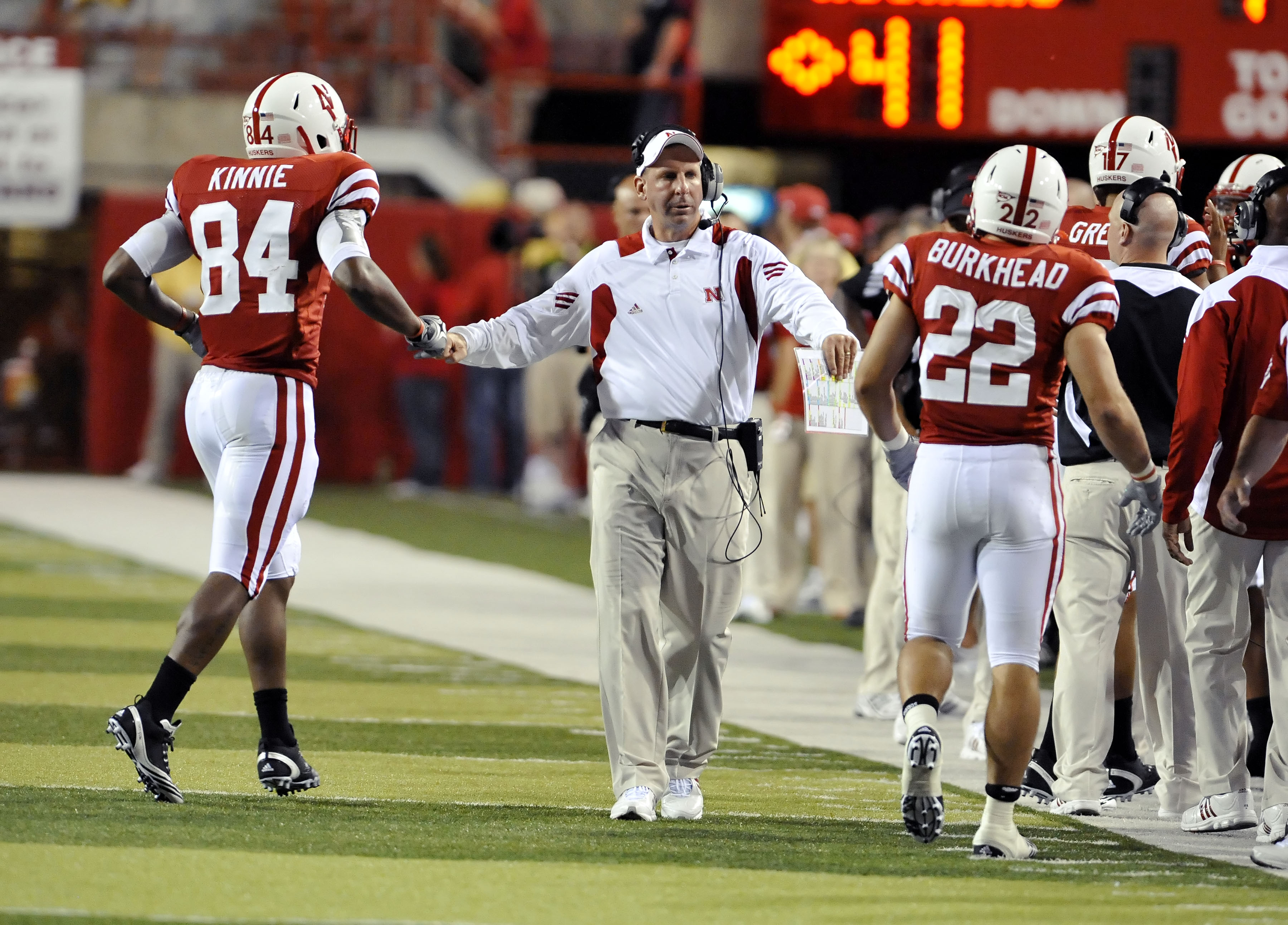 LINCOLN, NE - SEPTEMBER 04:  Head coach Bo Pelini of the Nebraska Cornhuskers congratulates Brandon Kinnie #84 and Rex Burkhead #22 of the Cornhuskers after scoring a second-half touchdown of their game at Memorial Stadium on September 4, 2010 in Lincoln,