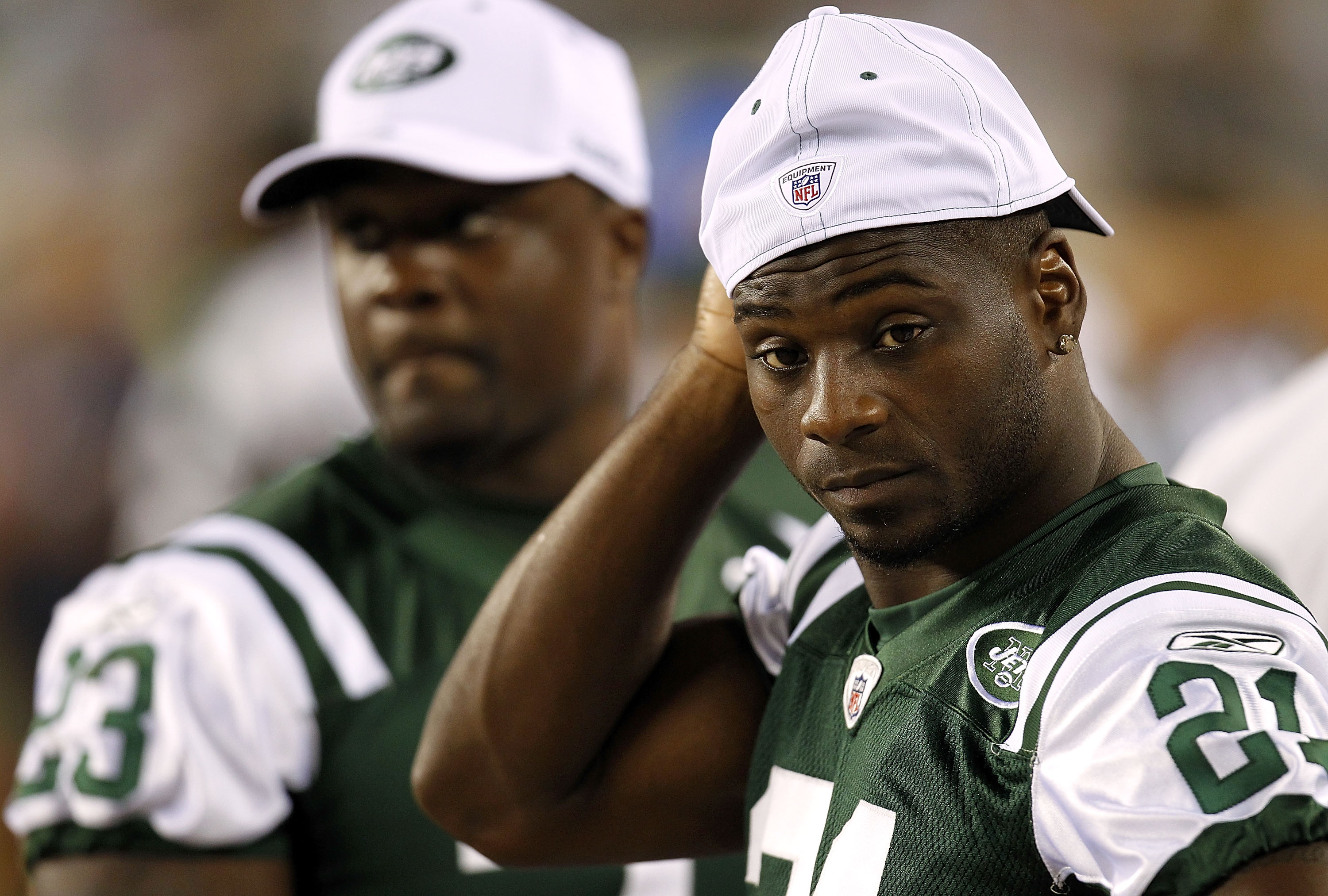 PHILADELPHIA - SEPTEMBER 02:  LaDainian Tomlinson #21 and Shonn Greene #23 of the New York Jets sit on the bench during a preseason game against the Philadelphia Eagles at Lincoln Financial Field on September 2, 2010 in Philadelphia, Pennsylvania.  (Photo