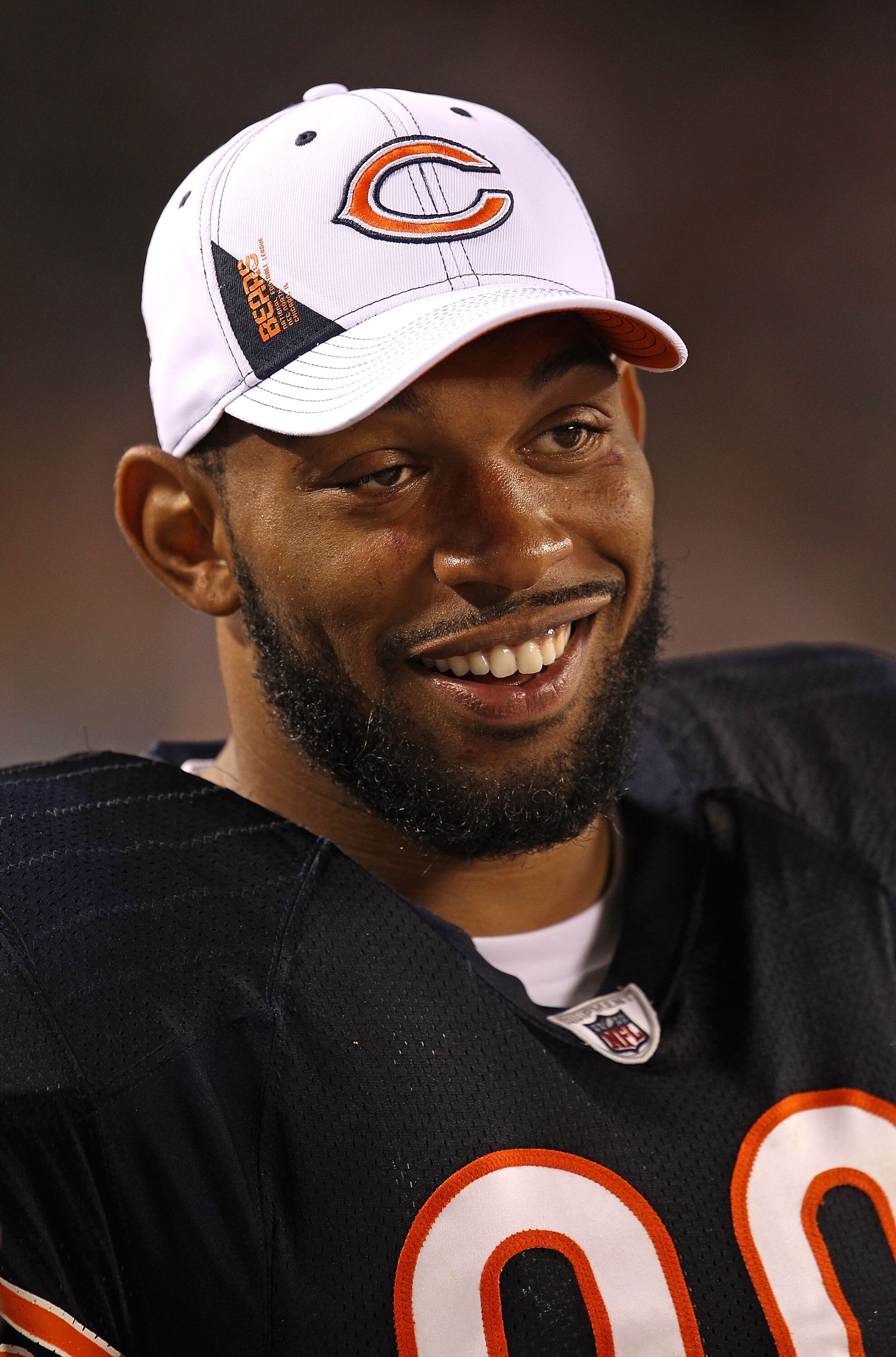 CHICAGO - AUGUST 21: Julius Peppers #90 of the Chicago Bears smiles on the sidelines during a preseason game against the Oakland Raiders at Soldier Field on August 21, 2010 in Chicago, Illinois. The Raiders defeated the Bears 32-17. (Photo by Jonathan Dan CHICAGO - AUGUST 21: Julius Peppers #90 of the Chicago Bears smiles on the sidelines during a preseason game against the Oakland Raiders at Soldier Field on August 21, 2010 in Chicago, Illinois. The Raiders defeated the Bears 32-17. (Photo by Jonathan Dan