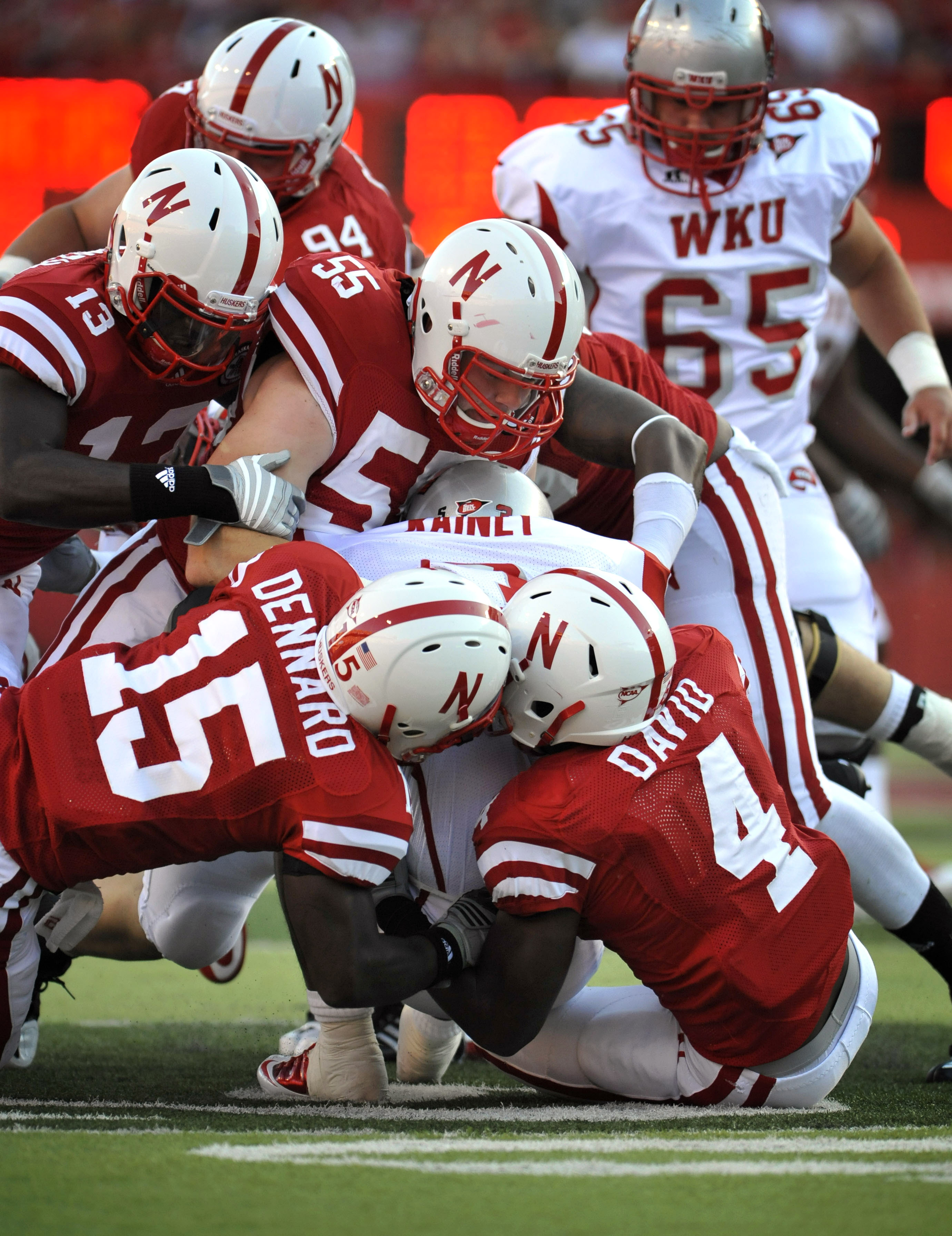 LINCOLN, NE - SEPTEMBER 04:  The Nebraska Cornhuskers defense swarms Bobby Rainey #3 of the Western Kentucky Hilltoppers during the first half of their game at Memorial Stadium on September 4, 2010 in Lincoln, Nebraska.  (Photo by Eric Francis/Getty Image