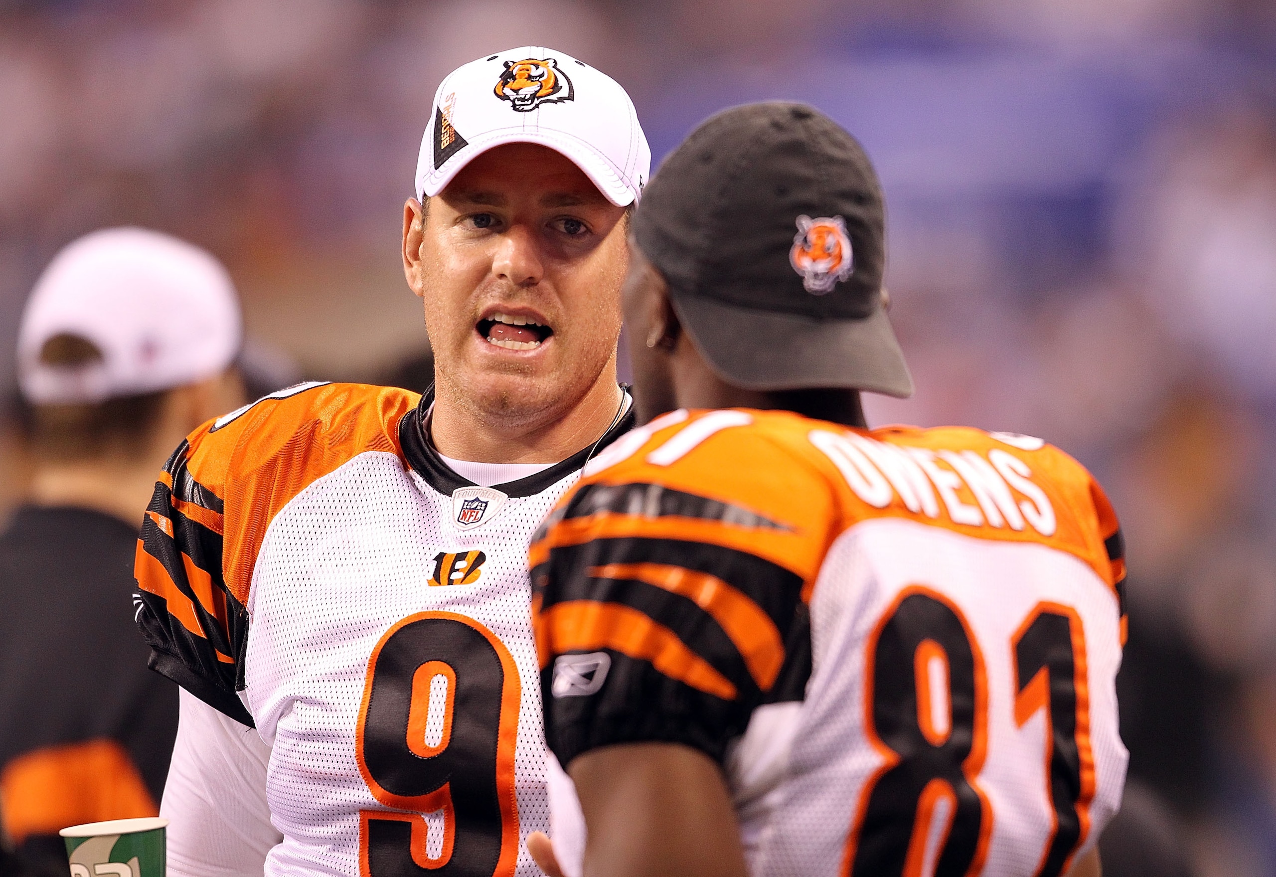 INDIANAPOLIS - SEPTEMBER 02:  Carson Palmer #9 and Terrell Owens #81 of the Cincinnati Bengals talk on the sidelines during the NFL preseason game against the Indianapolis Colts at Lucas Oil Stadium on September 2, 2010 in Indianapolis, Indiana.  (Photo b