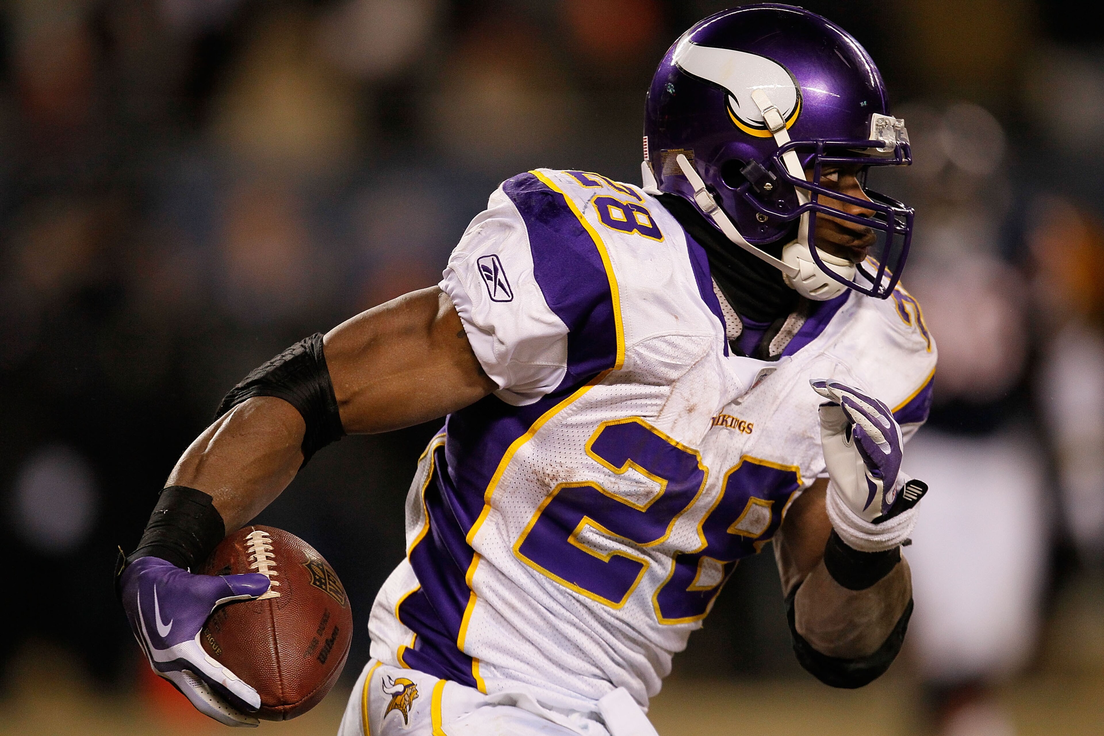CHICAGO - DECEMBER 28: Adrian Peterson #28 of the Minnesota Vikings runs against the Chicago Bears at Soldier Field on December 28, 2009 in Chicago, Illinois. The Bears defeated the Vikings 36-30 in overtime.  (Photo by Jonathan Daniel/Getty Images)