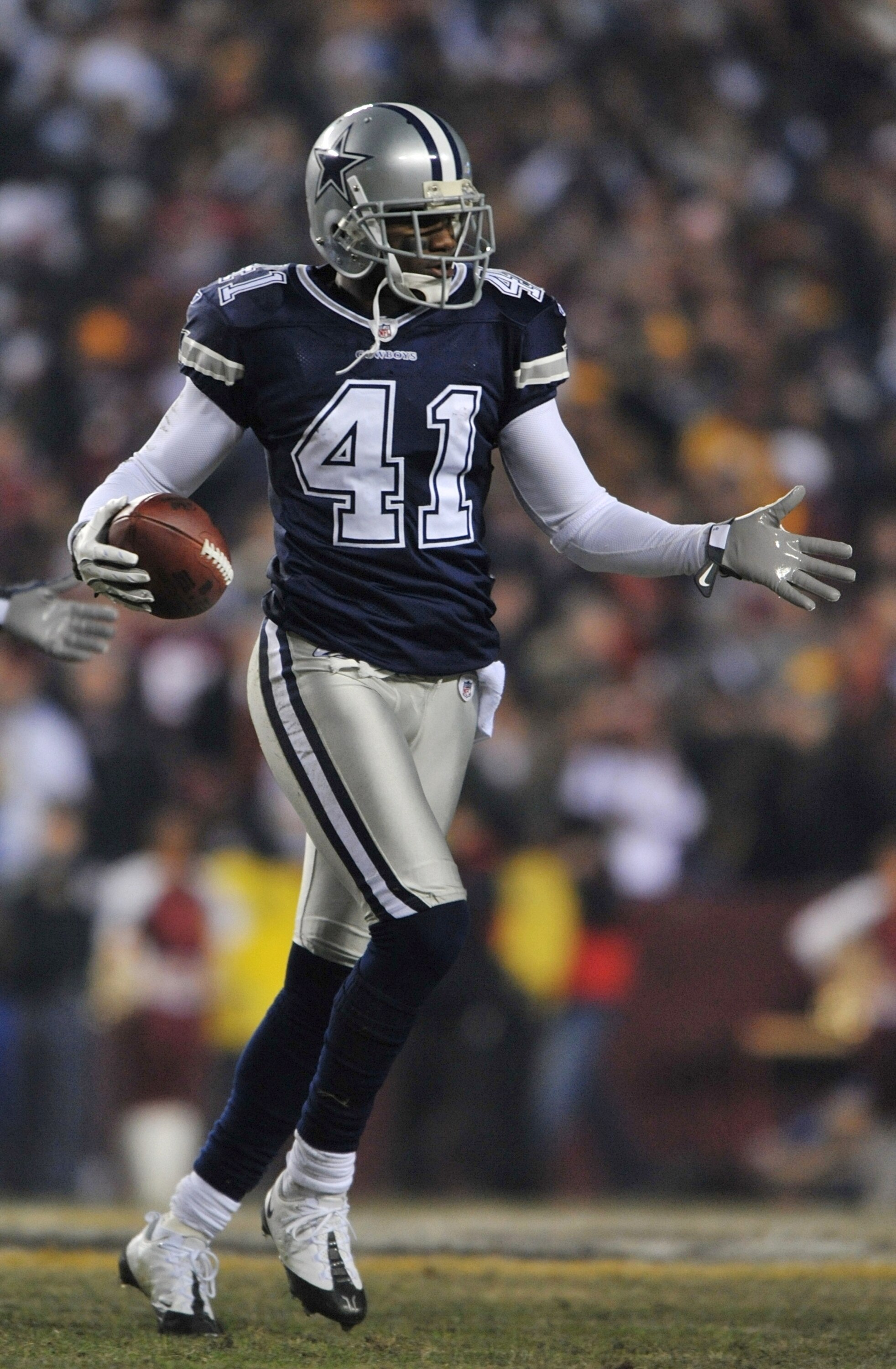LANDOVER, MD - DECEMBER 21: Cornerback Terence Newman #41 of the Dallas Cowboys runs off the field after intercepting a pass by quarterback Jason Campbell #17 of the Washington Redskins at FedEx Field on December 27, 2009 in Landover, Maryland. (Photo by 