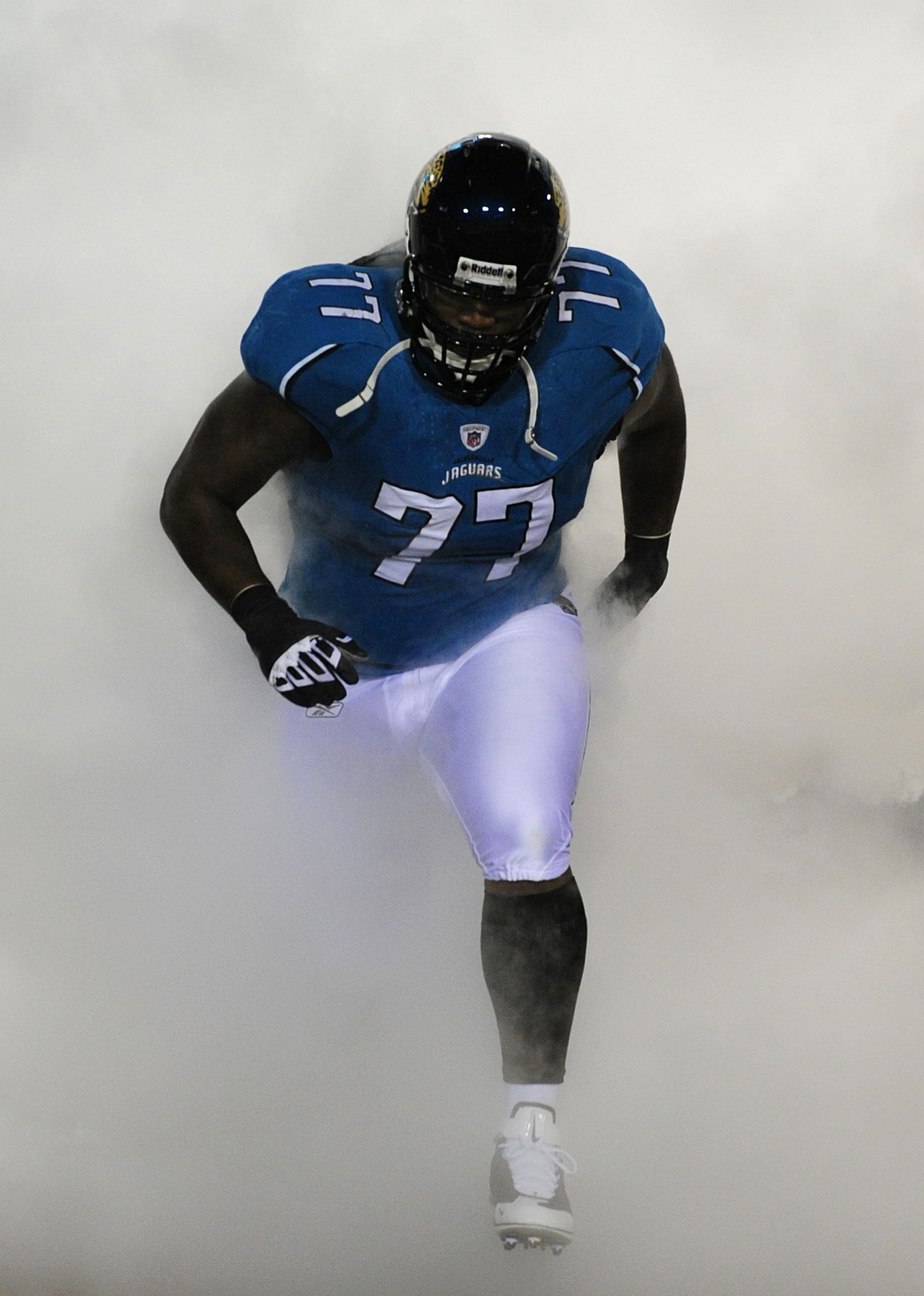 JACKSONVILLE, FL - DECEMBER 17:  Uche Nwaneri #77 of the Jacksonville Jaguars takes the field during player introductions against the Indianapolis Colts at Jacksonville Municipal Stadium on December 17, 2009 in Jacksonville, Florida.  (Photo by Sam Greenw