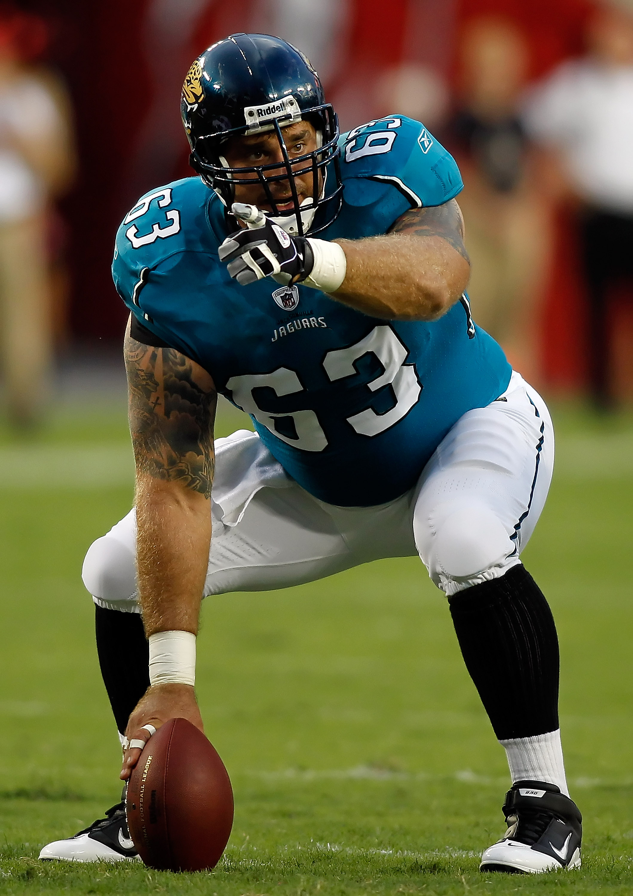 TAMPA, FL - AUGUST 28:  Center Brad Meester #63 of the Jacksonville Jaguars points out the defense against the Tampa Bay Buccaneers during a preseason game at Raymond James Stadium on August 28, 2010 in Tampa, Florida.  (Photo by J. Meric/Getty Images)