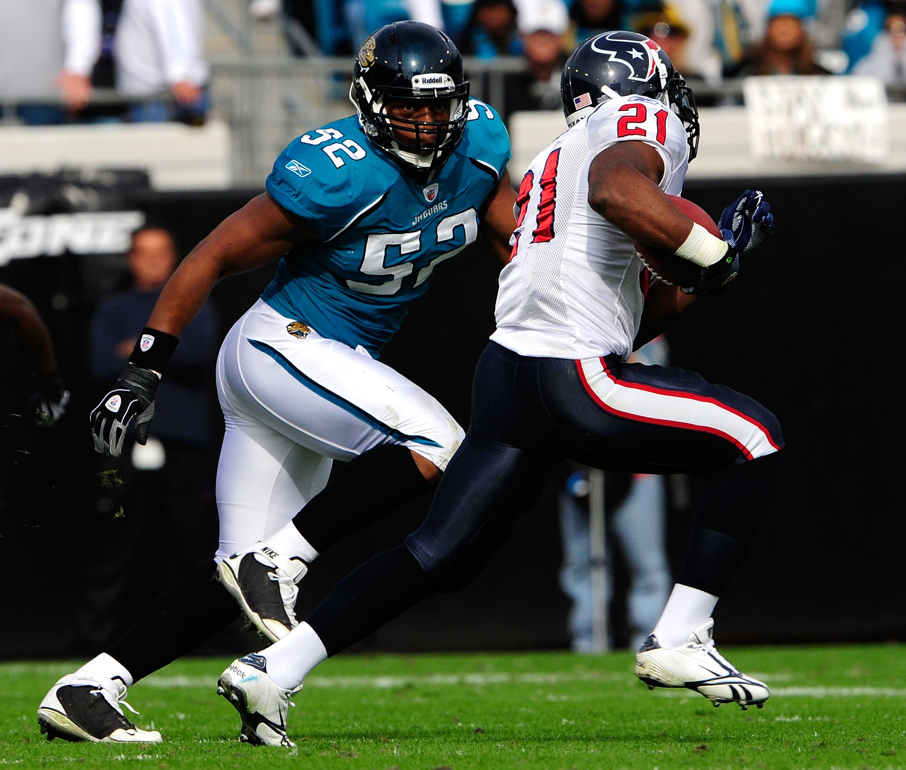 JACKSONVILLE, FL - DECEMBER 06:  Daryl Smith #52 of the Jacksonville Jaguars attempts to tackle Ryan Moats #21 of the Houston Texans during the game at Jacksonville Municipal Stadium on December 6, 2009 in Jacksonville, Florida.  (Photo by Sam Greenwood/G