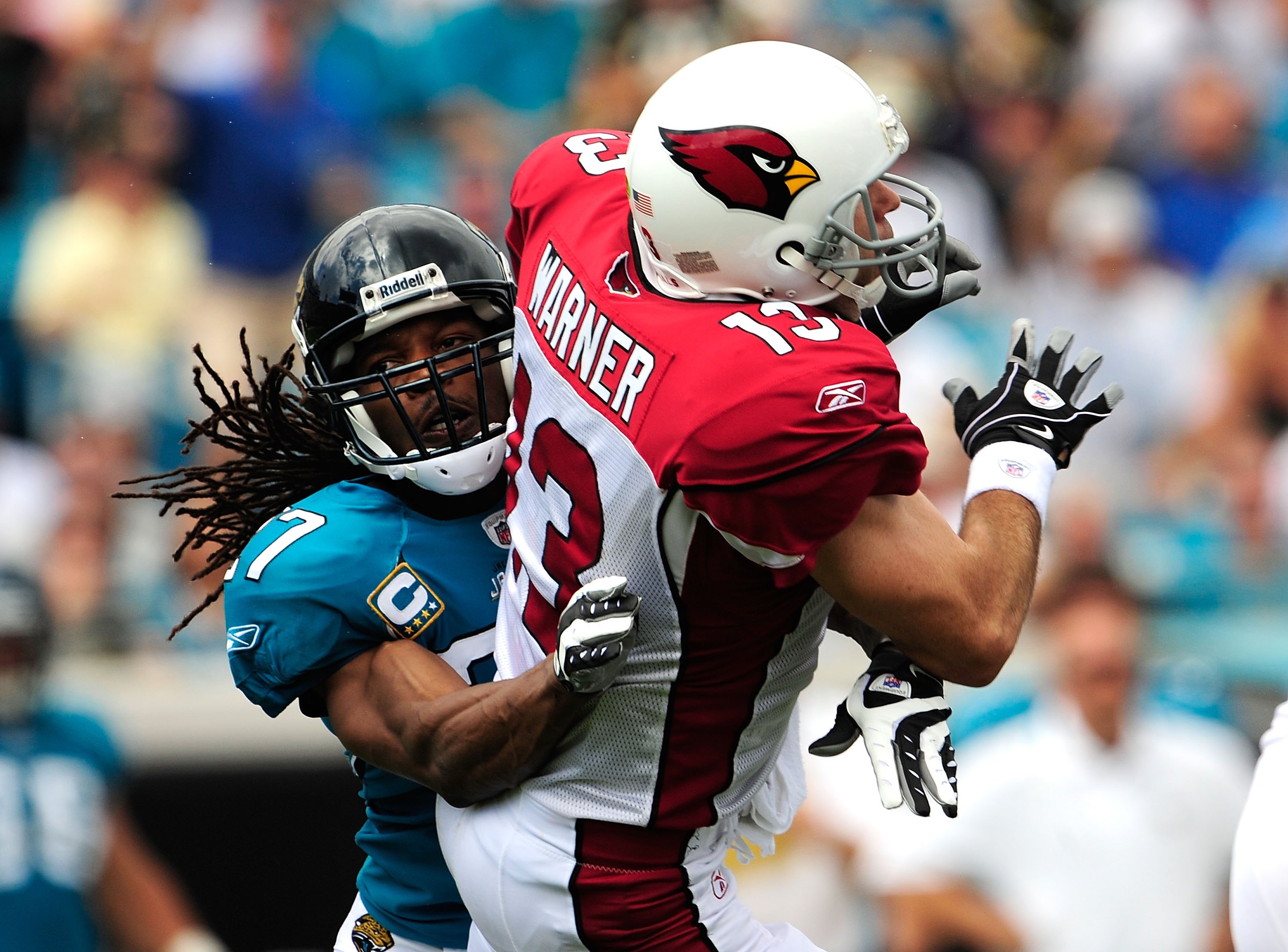 JACKSONVILLE, FL - SEPTEMBER 20:  Kurt Warner #13 of the Arizona Cardinals is tackled by Rashean Mathis #27 of the Jacksonville Jaguars during the game at Jacksonville Municipal Stadium on September 20, 2009 in Jacksonville, Florida.  (Photo by Sam Greenw