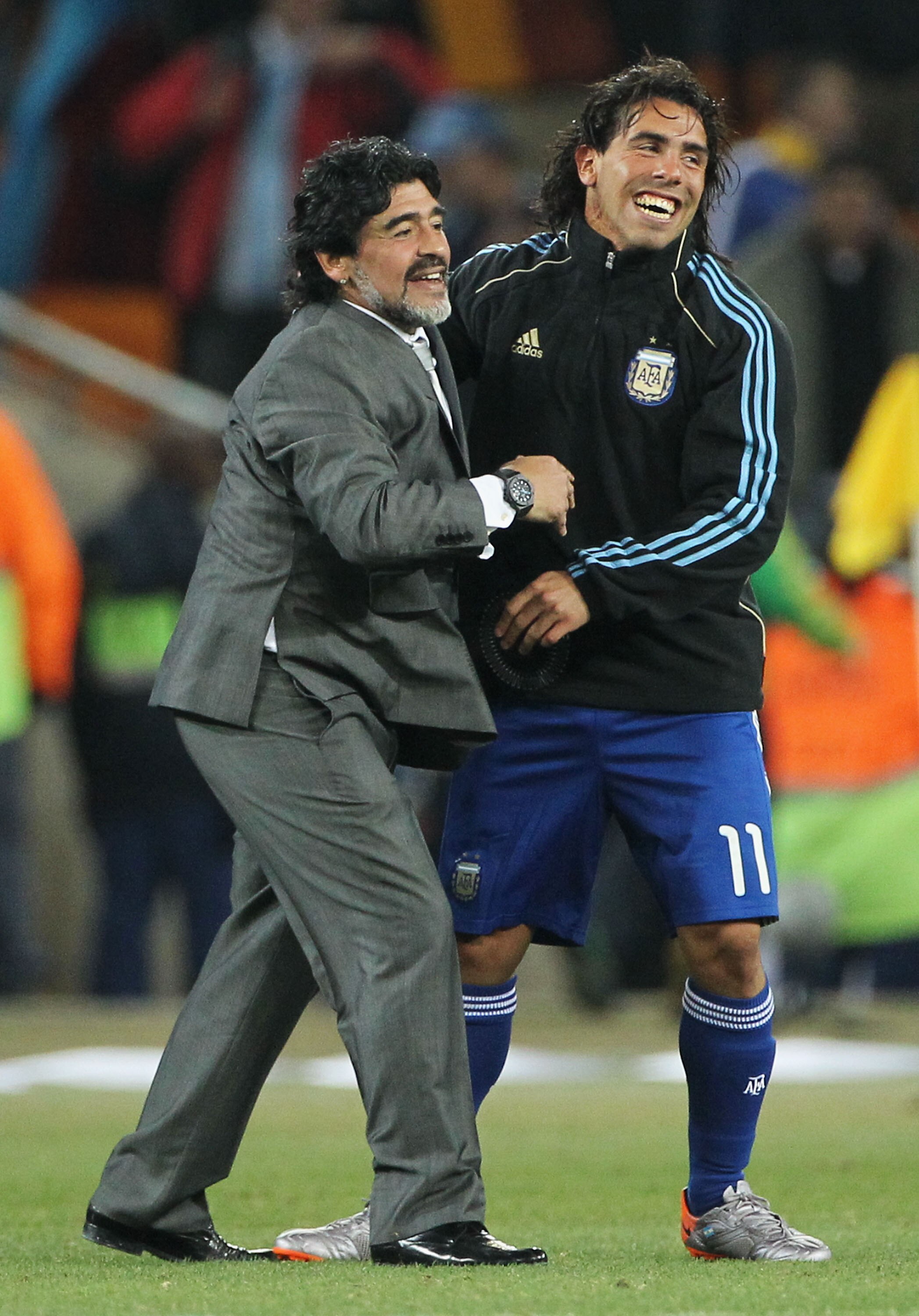 JOHANNESBURG, SOUTH AFRICA - JUNE 27:  Diego Maradona head coach of Argentina celebrates victory with Carlos Tevez following the 2010 FIFA World Cup South Africa Round of Sixteen match between Argentina and Mexico at Soccer City Stadium on June 27, 2010 i
