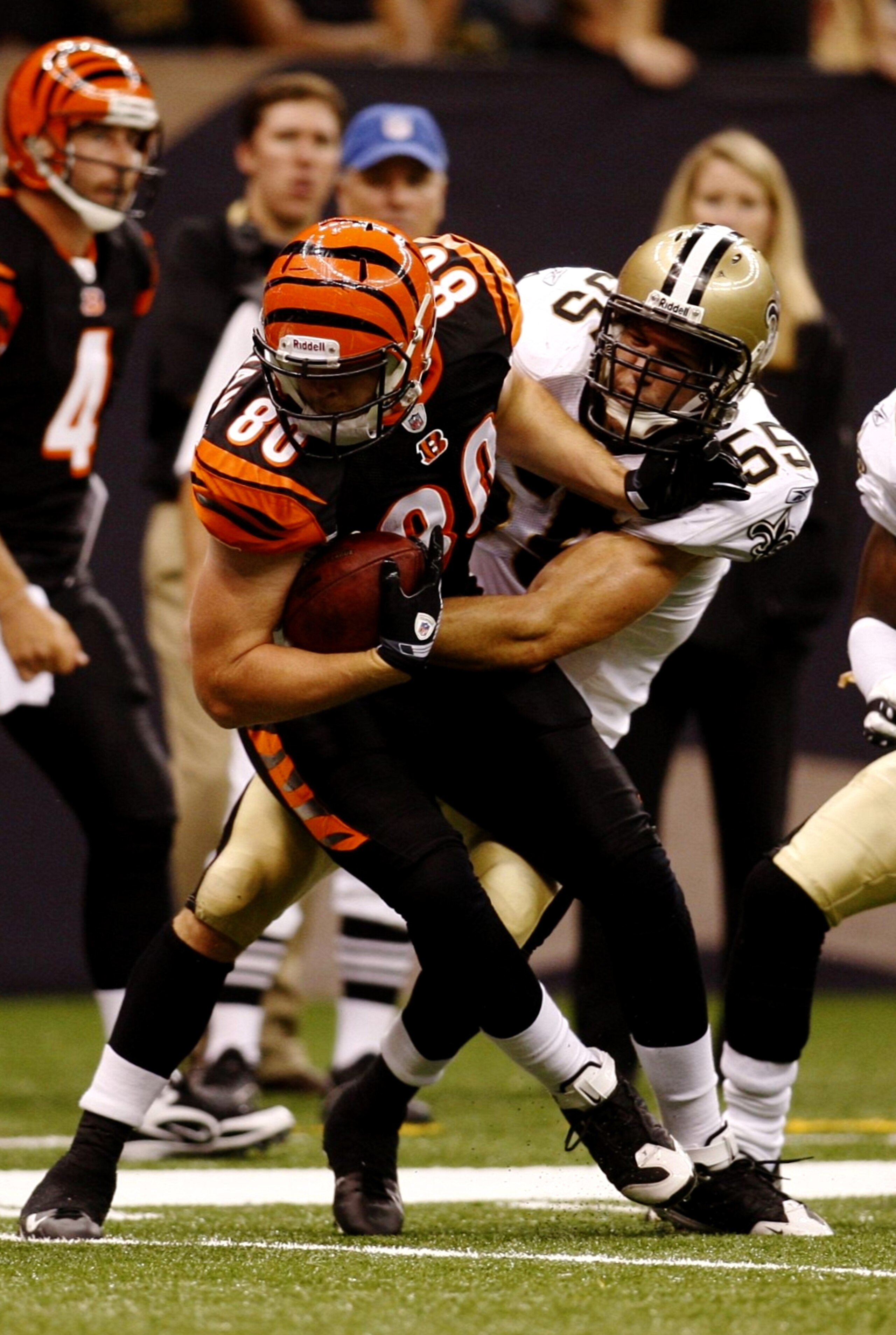 NEW ORLEANS - AUGUST 14:  Tight end Chase Coffman #80 of the Cincinnati Bengals is tackled by linebacker Scott Fujita #55 of of the New Orleans Saints during a preseason game on August 14, 2009 at the Superdome in New Orleans, Louisiana. (Photo by Chris G