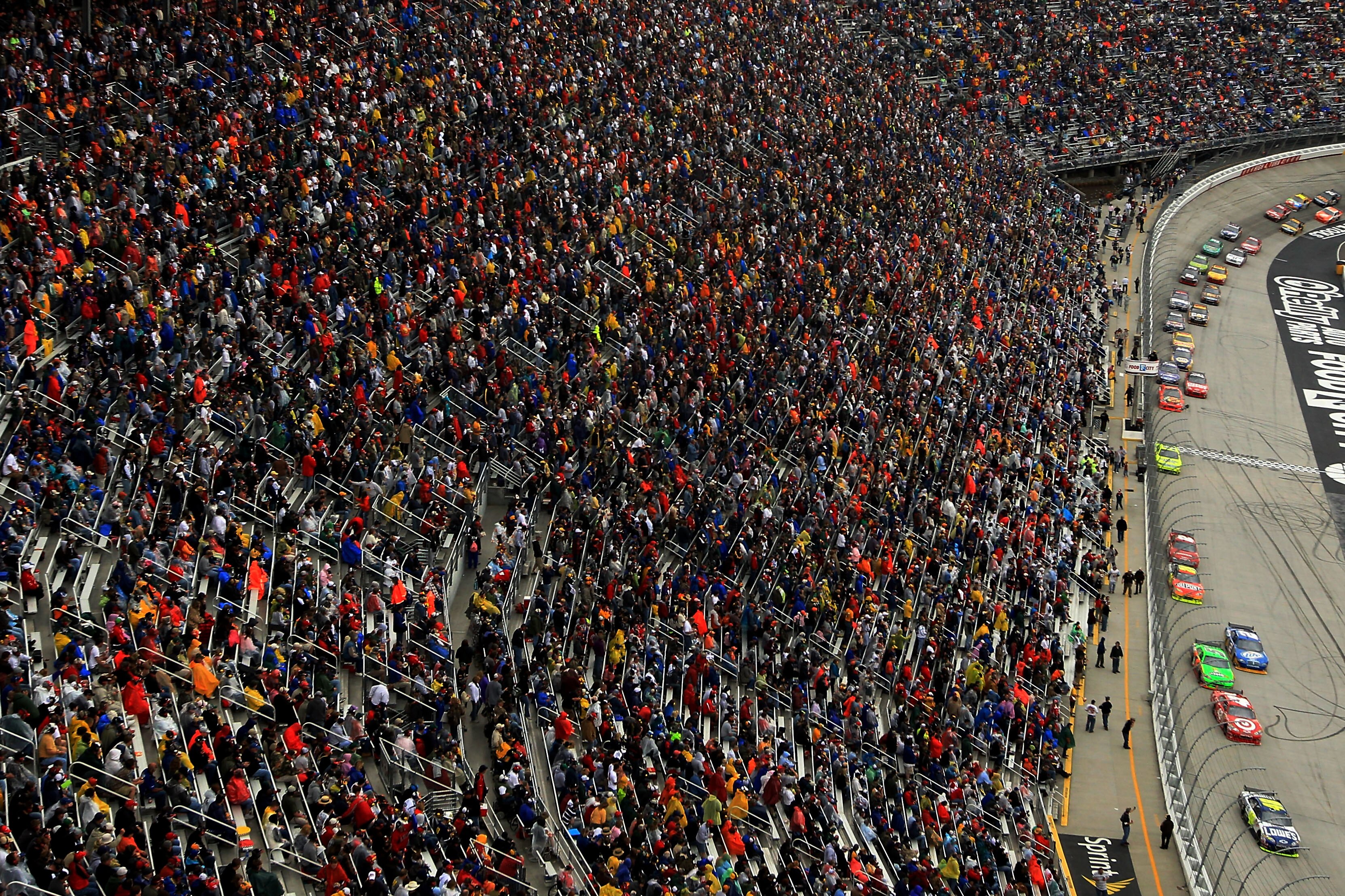 BRISTOL, TN - MARCH 21:  Jimmie Johnson, driver of the #48 Lowe's Chevrolet, takes the lead against Tony Stewart, driver of the #14 Office Depot Chevrolet, during the NASCAR Sprint Cup Series Food City 500 at Bristol Motor Speedway on March 21, 2010 in Br