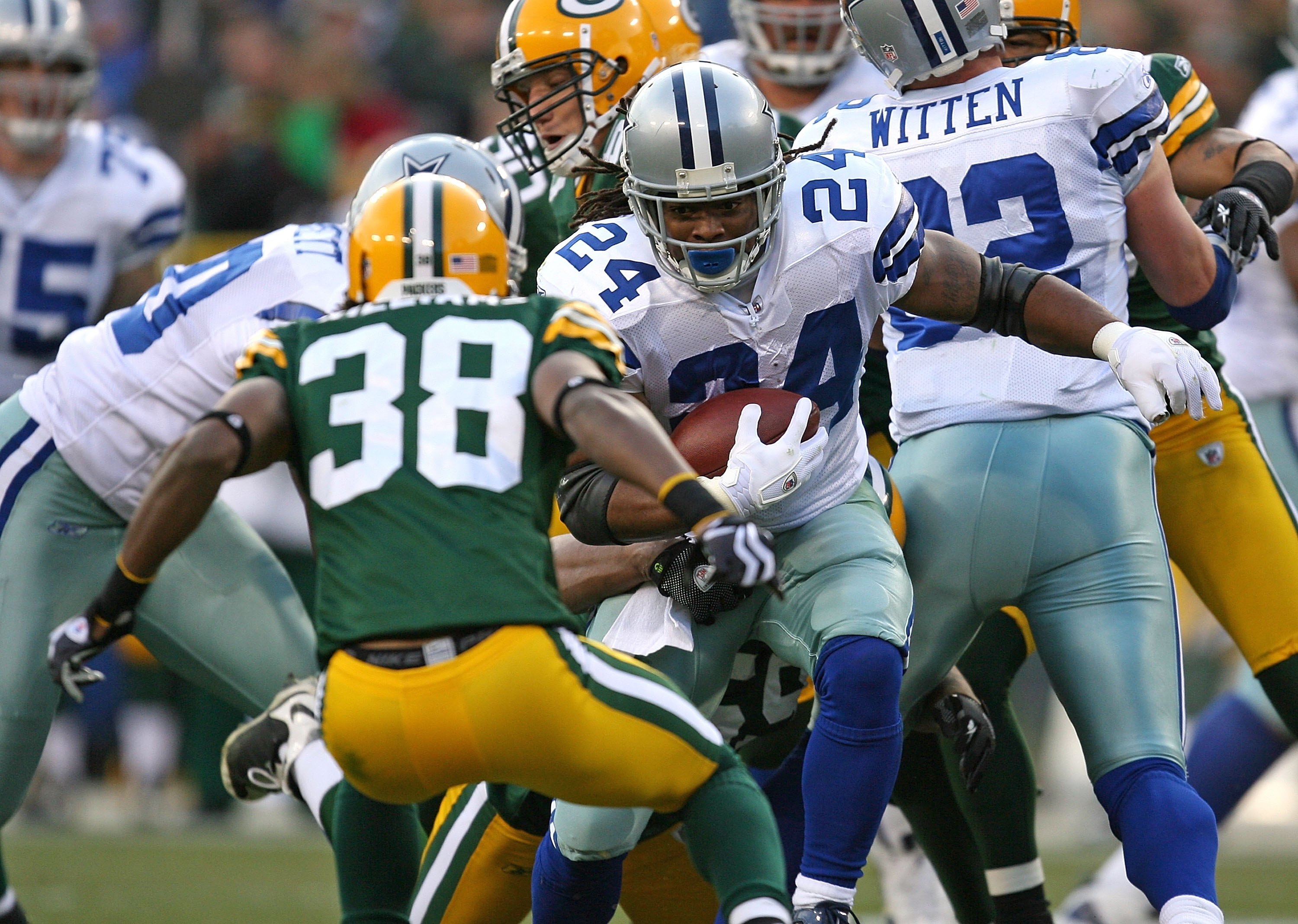 GREEN BAY, WI - NOVEMBER 15: Marion Barber #24 of the Dallas Cowboys runs at Tramon Williams #38 of the Green Bay Packers at Lambeau Field on November 15, 2009 in Green Bay, Wisconsin. The Packers defeated the Cowboys 17-7. (Photo by Jonathan Daniel/Getty