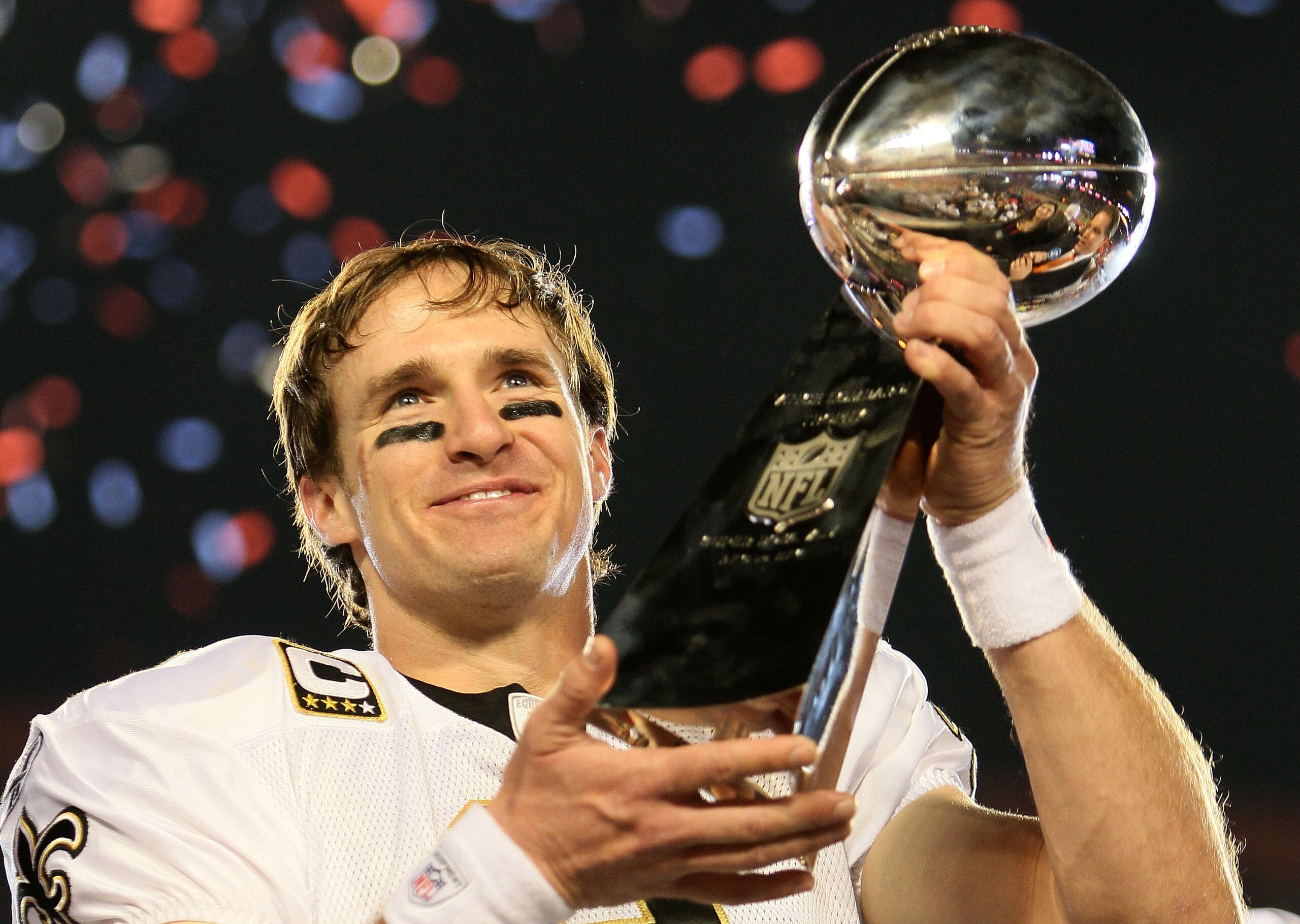 MIAMI GARDENS, FL - FEBRUARY 07: Drew Brees #9 of the New Orleans Saints holds up the Vince Lombardi Trophy after defeating the Indianapolis Colts during Super Bowl XLIV on February 7, 2010 at Sun Life Stadium in Miami Gardens, Florida.  (Photo by Andy Ly