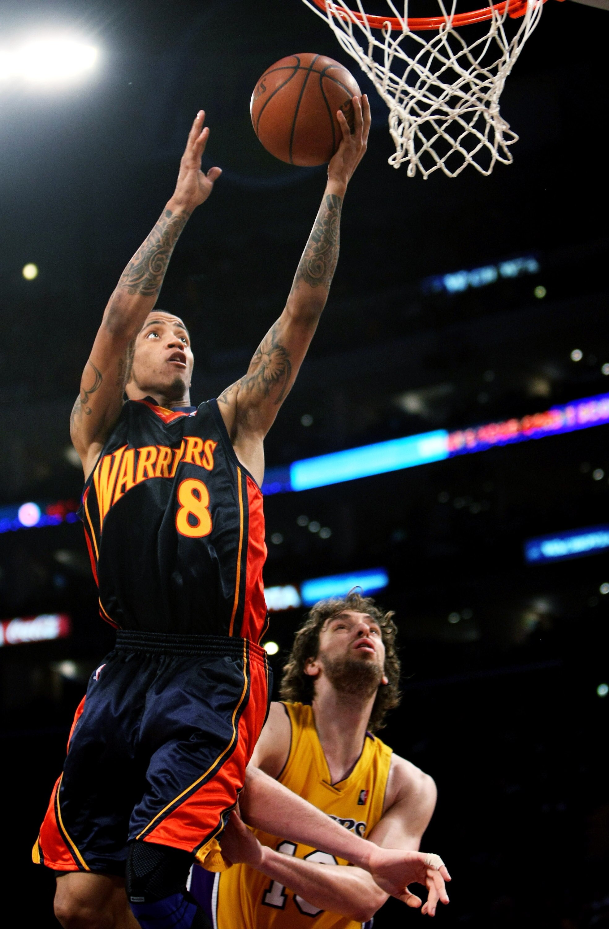 LOS ANGELES, CA - DECEMBER 29:  Monta Ellis #8 of the Golden State Warriors shoots over Pau Gasol #16 of the Los Angeles Lakers on December 29, 2009 at Staples Center in Los Angeles, California.  The Lakers won 124-118. NOTE TO USER: User expressly acknow