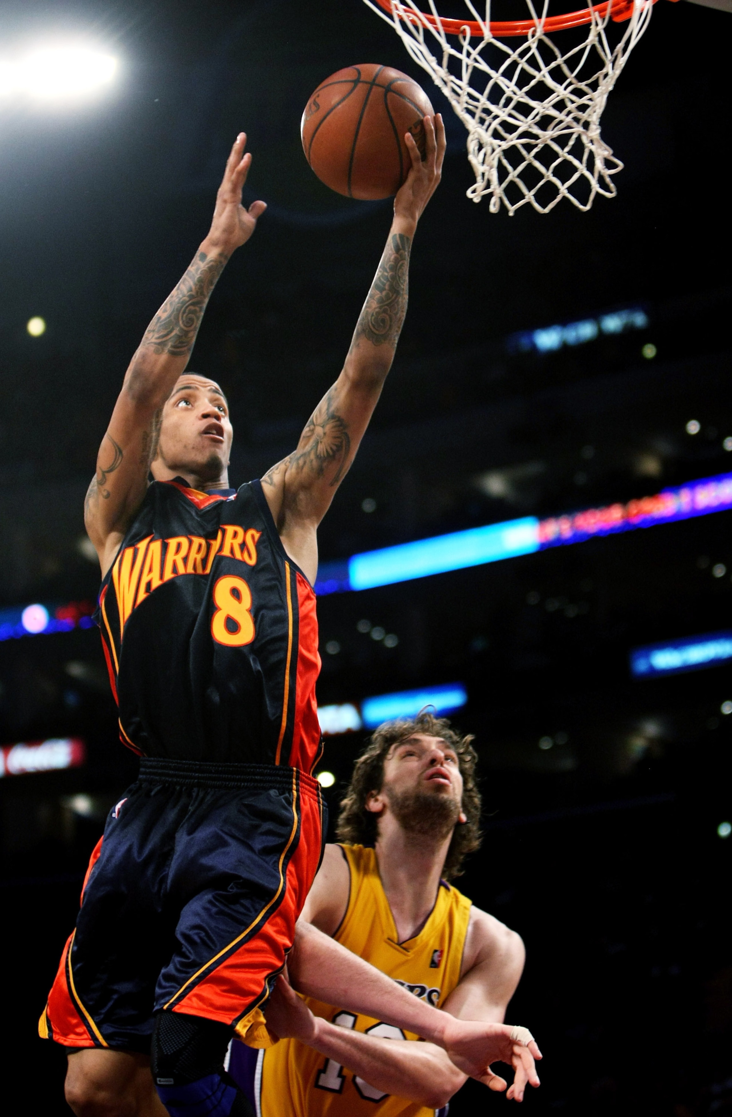 LOS ANGELES, CA - DECEMBER 29:  Monta Ellis #8 of the Golden State Warriors shoots over Pau Gasol #16 of the Los Angeles Lakers on December 29, 2009 at Staples Center in Los Angeles, California.  The Lakers won 124-118. NOTE TO USER: User expressly acknow