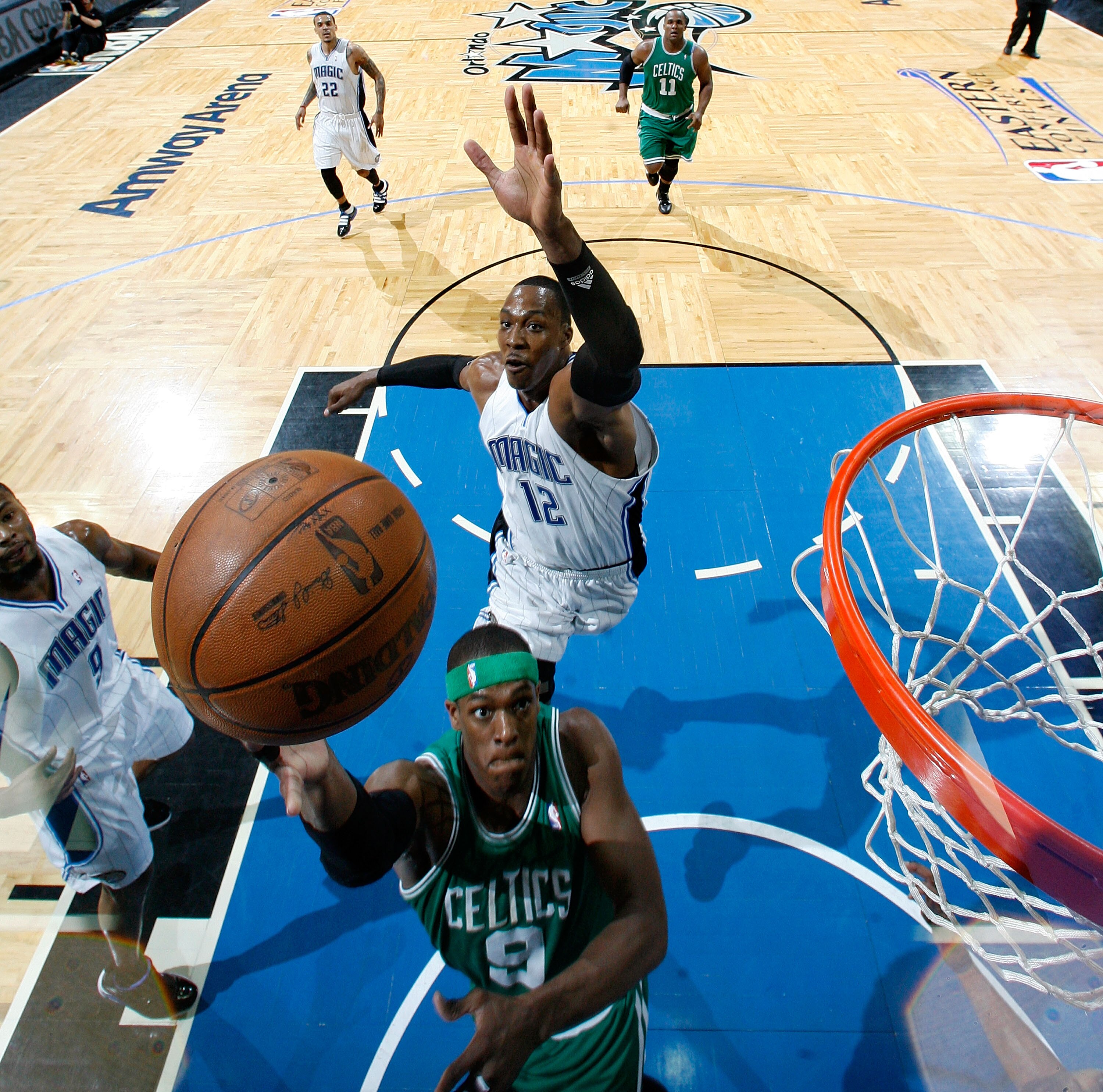 ORLANDO, FL - MAY 26:  Rajon Rondo #9 of  the Boston Celtics drives for a shot attempt against Dwight Howard #12 of the Orlando Magic in Game Five of the Eastern Conference Finals during the 2010 NBA Playoffs at Amway Arena on May 26, 2010 in Orlando, Flo