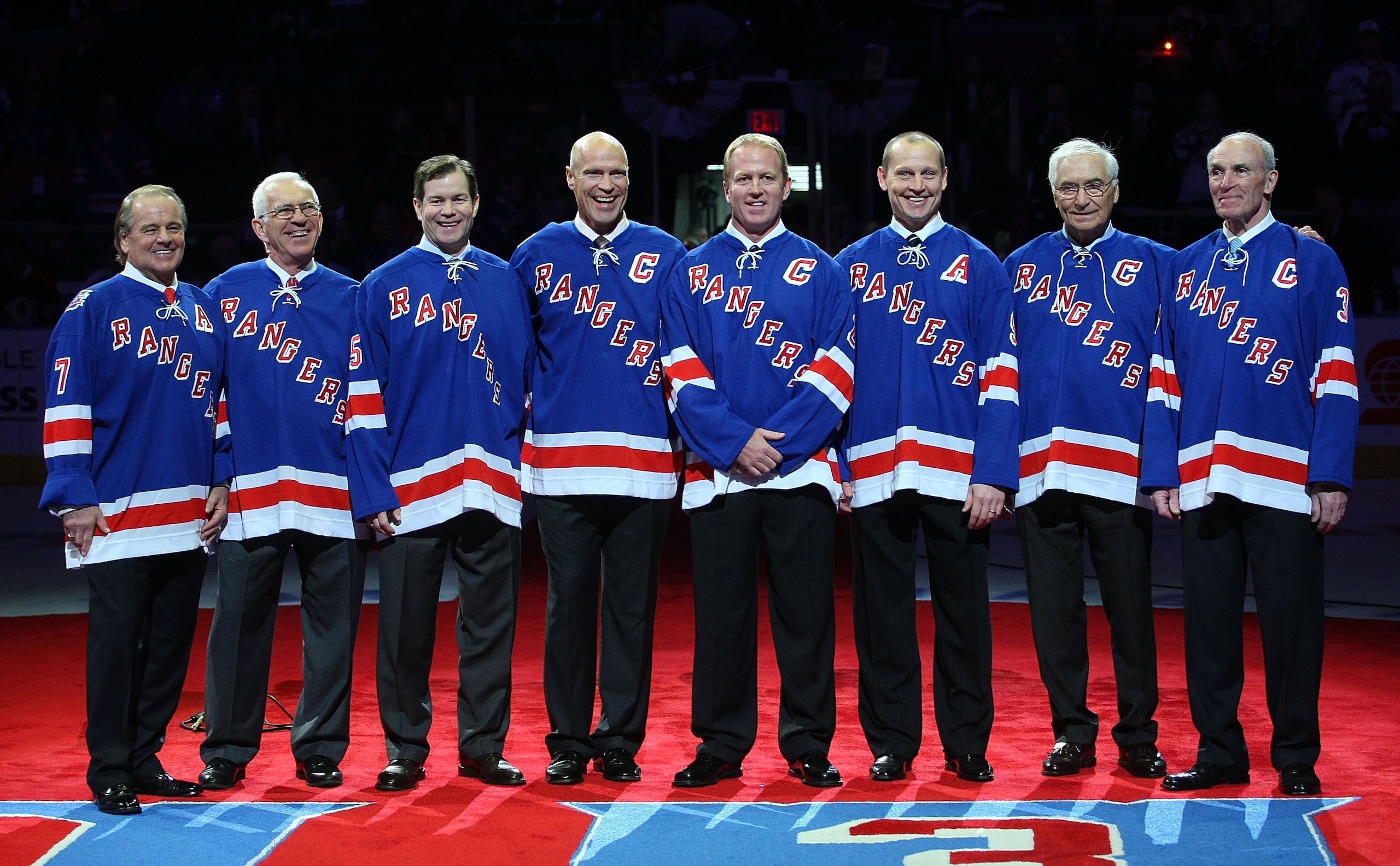 NEW YORK - FEBRUARY 22:  Former New York Ranger players  whose numbers have been retired join with Andy Bathgate and Harry Howell as they are given the same honor prior to the game between the Toronto Maple Leafs and the New York Rangers on February 22, 2