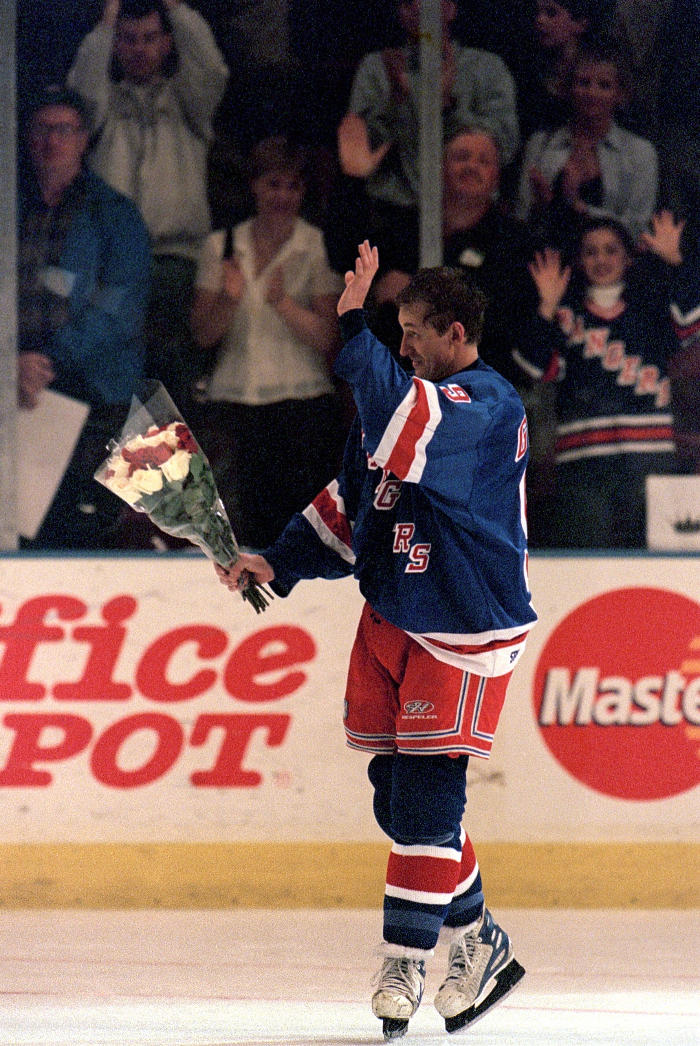 NEW YORK, NY - APRIL 18:  Wayne Gretzky #99 of the New York Rangers waves to the crowd as he skates on the ice during retirement ceremonies after his final career game against the Pittsburgh Penguins at the Madison Square Garden on April 18, 1999 in New Y
