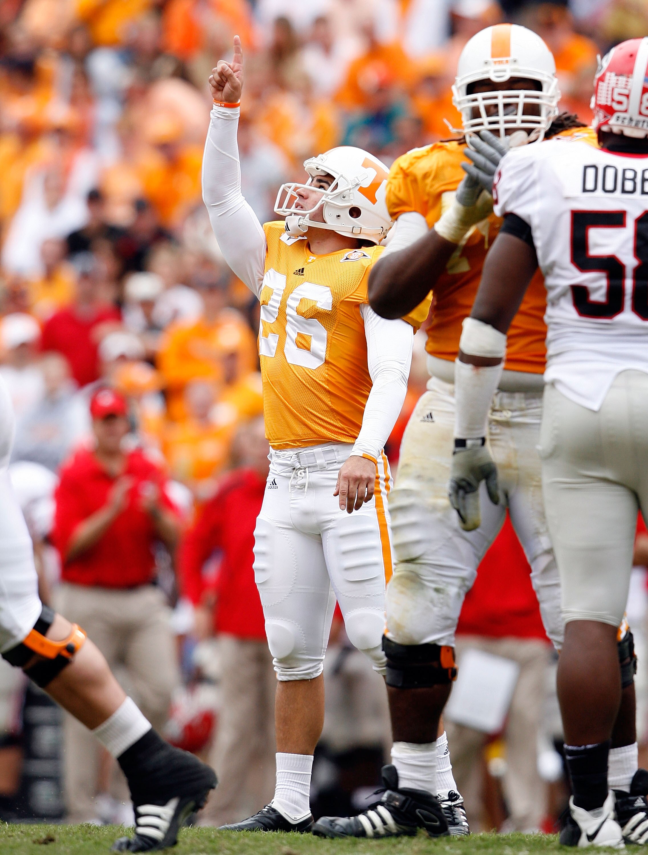 KNOXVILLE, TN - OCTOBER 10: Daniel Lincoln #26 of the Tennessee Volunteers celebrates after kicking a field goal during the SEC game against the Georgia Bulldogs at Neyland Stadium on October 10, 2009 in Knoxville, Tennessee. (Photo by Andy Lyons/Getty Im