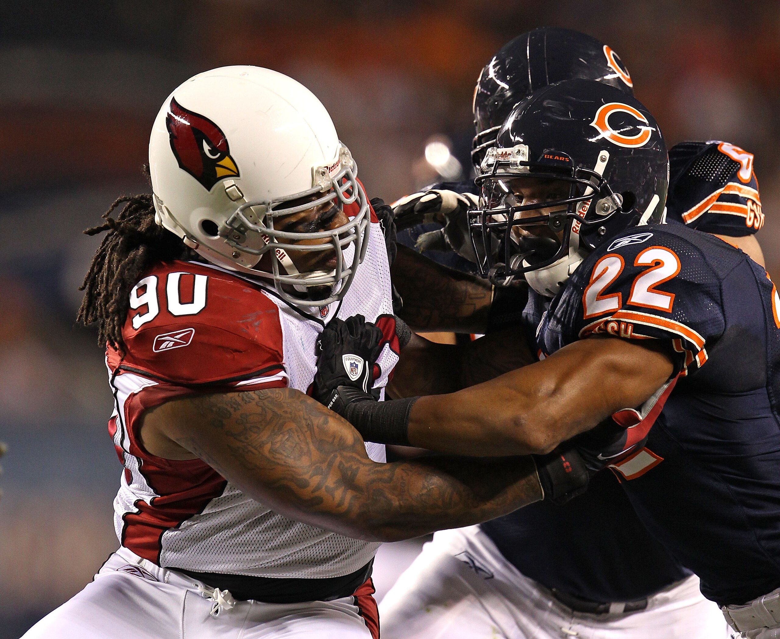 CHICAGO - AUGUST 28: Darnell Dockett #90 of the Arizona Cardinals rushes against Matt Forte #22 of the Chicago Bears during a preseason game at Soldier Field on August 28, 2010 in Chicago, Illinois. The Cardinals defeated the Bears 14-9. (Photo by Jonatha